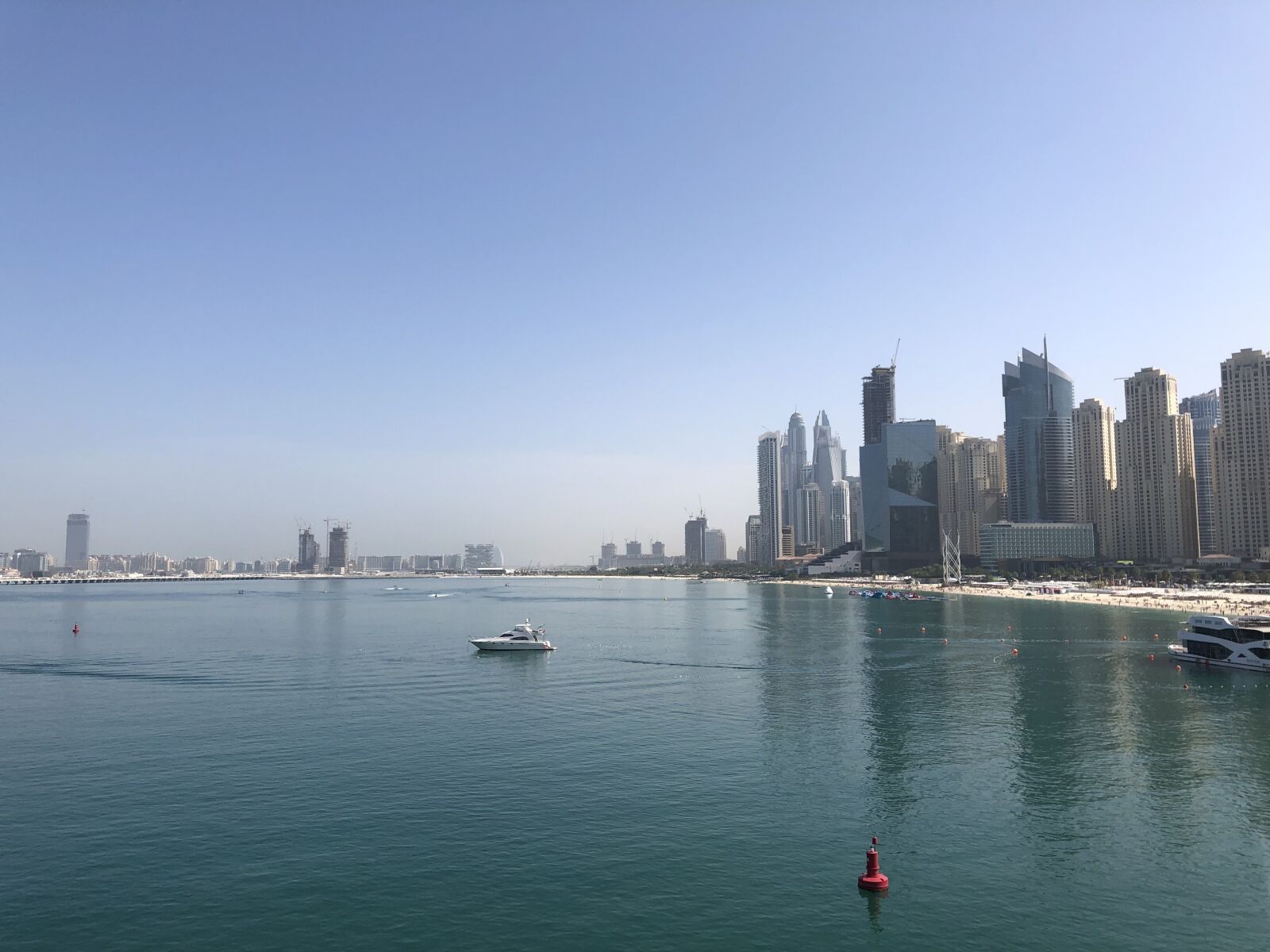 Apple iPhone X sample photo. Dubai, sea, skyscraper photography