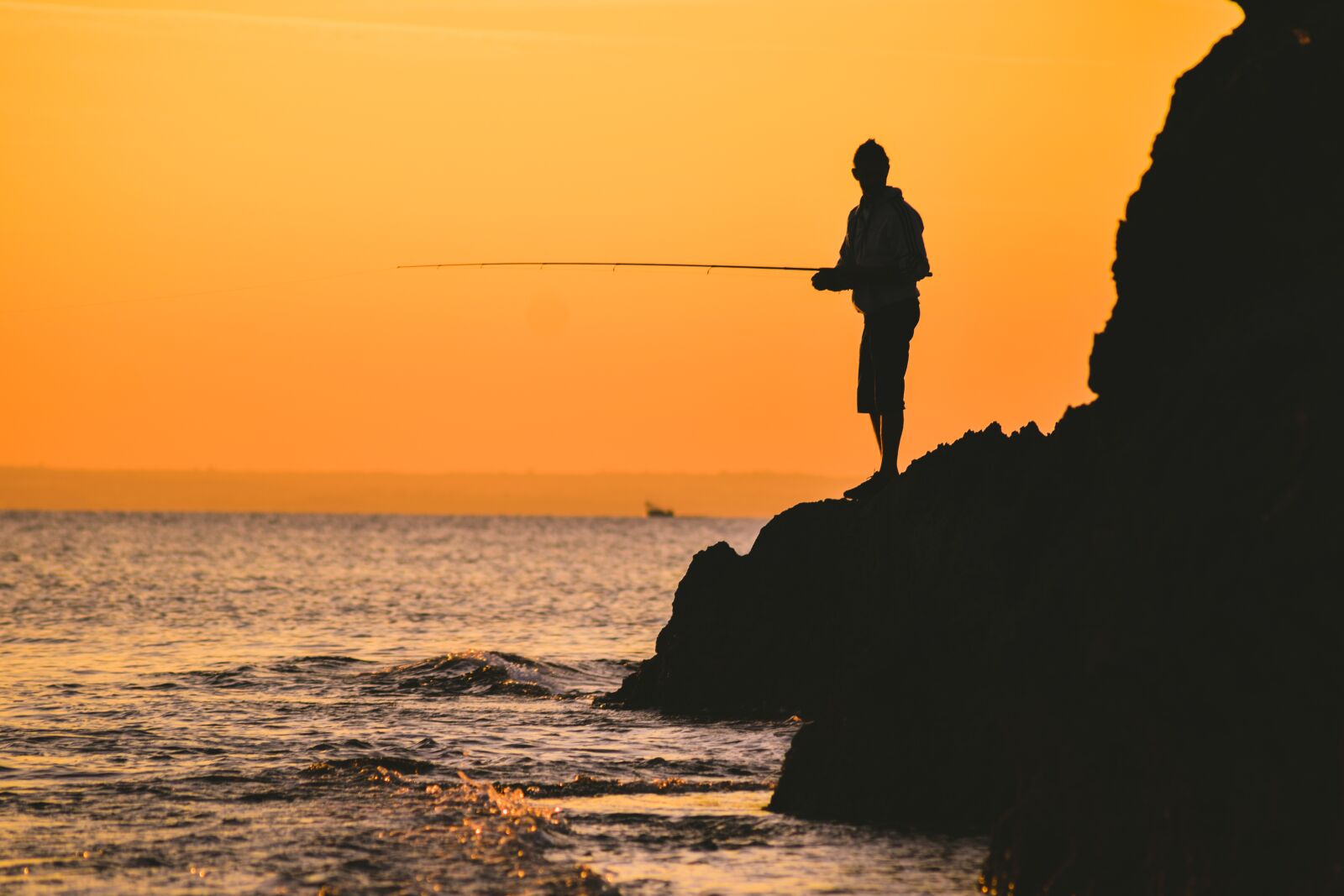 Nikon D3300 sample photo. Fisherman, rock, sea photography