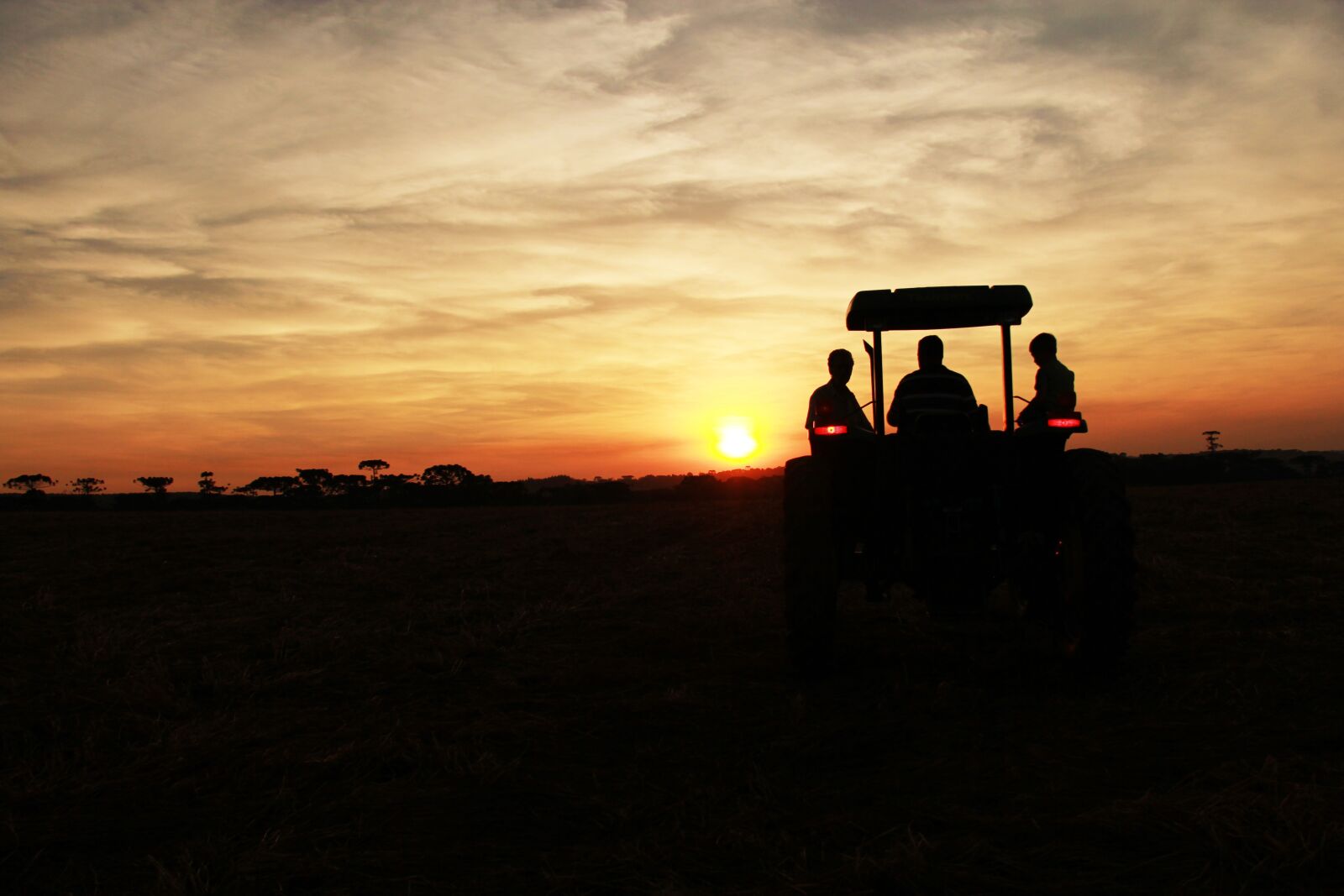 Canon EF-S 18-200mm F3.5-5.6 IS sample photo. Sunset, tractor, silhouette photography