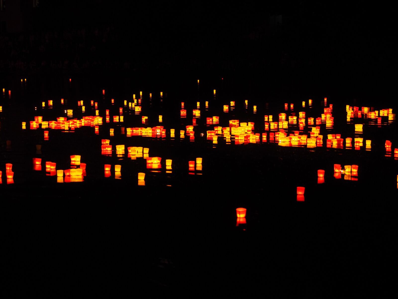 Olympus OM-D E-M1 + Olympus M.Zuiko Digital ED 12-40mm F2.8 Pro sample photo. Candles, lights serenade, river photography