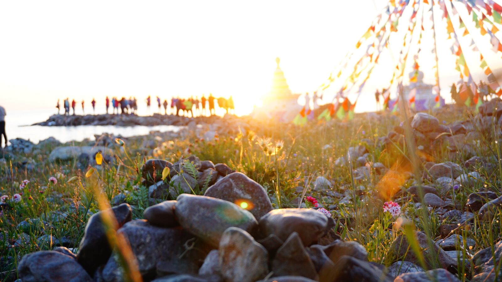 Sony a6000 sample photo. Sunrise, people, prayer flags photography