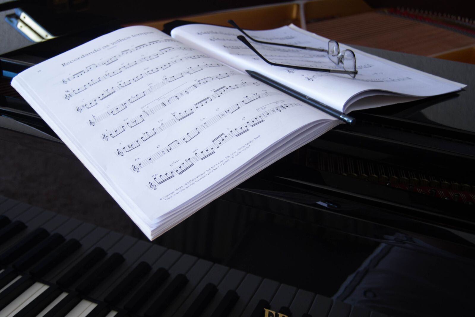 Nikon D3100 sample photo. Music sheet, glasses, piano photography