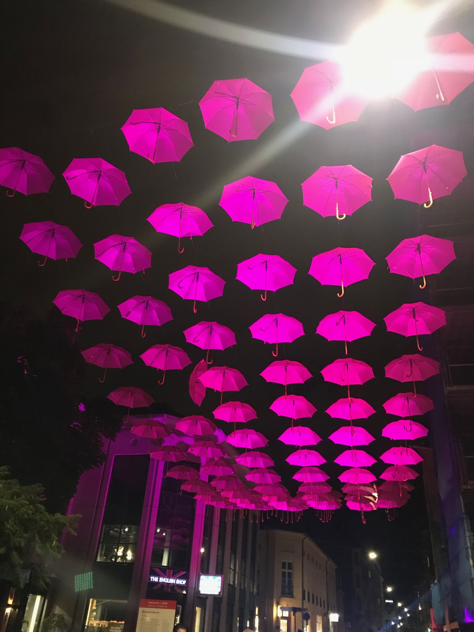 iPhone 7 back camera 3.99mm f/1.8 sample photo. Pink, night, umbrellas photography