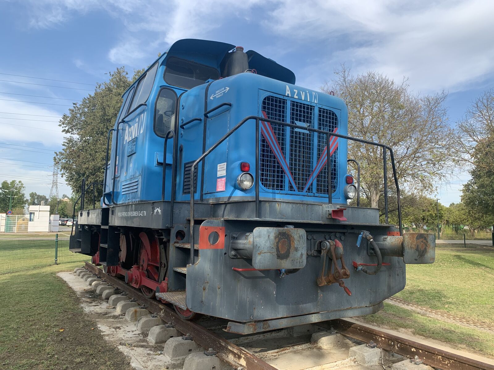iPhone XS Max back dual camera 4.25mm f/1.8 sample photo. Train, park, blue photography