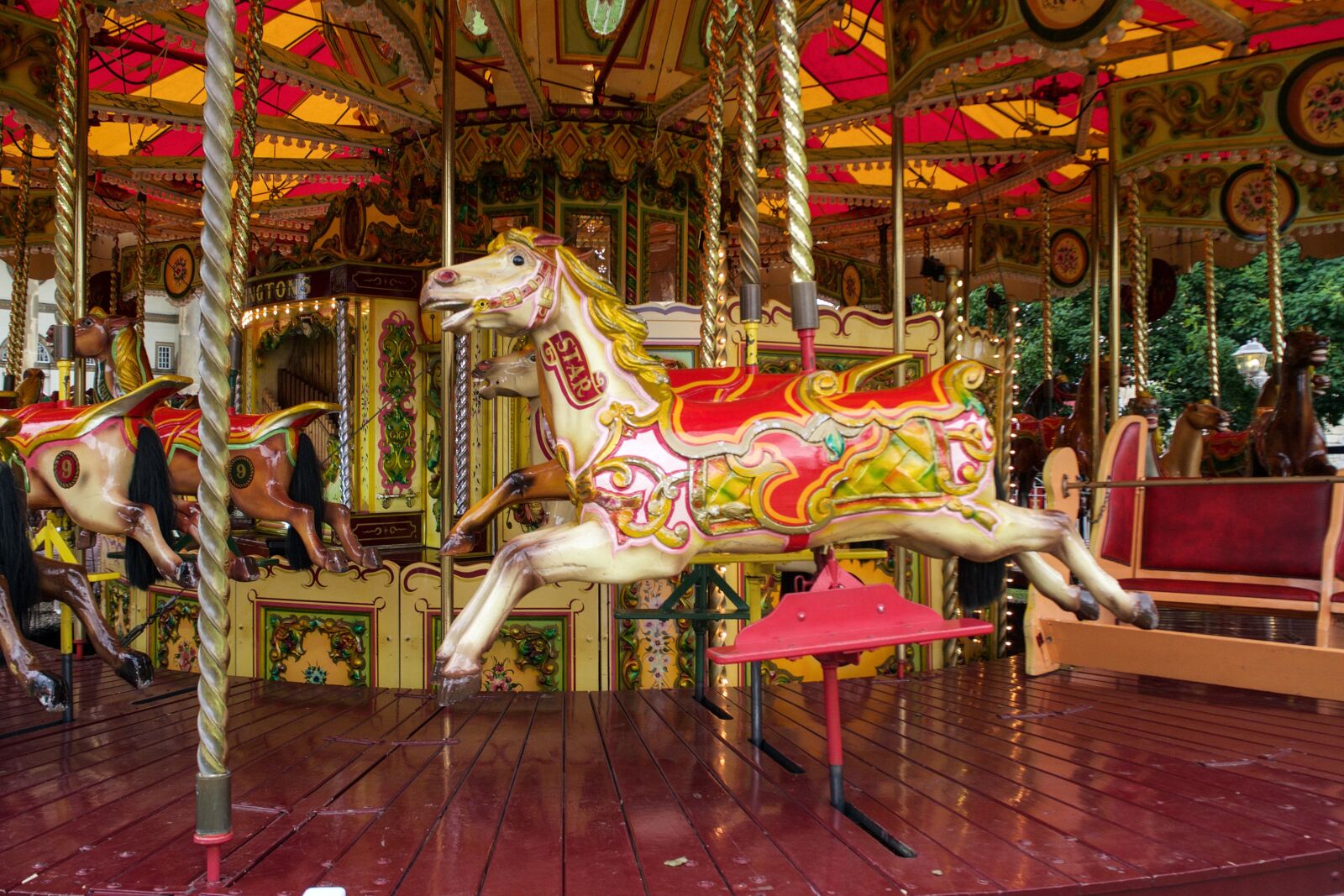 Olympus OM-D E-M10 sample photo. Carousel, carousel horses, wooden photography