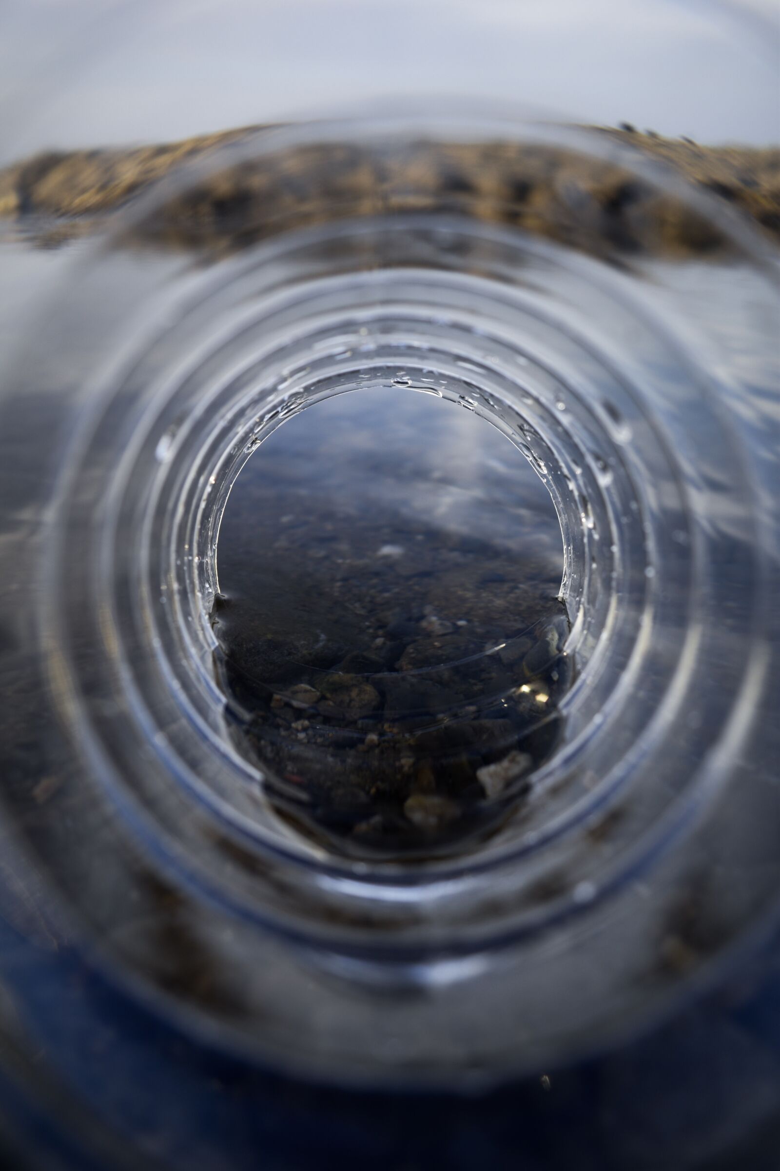 Nikon D3500 sample photo. Bottle, water, rocks photography