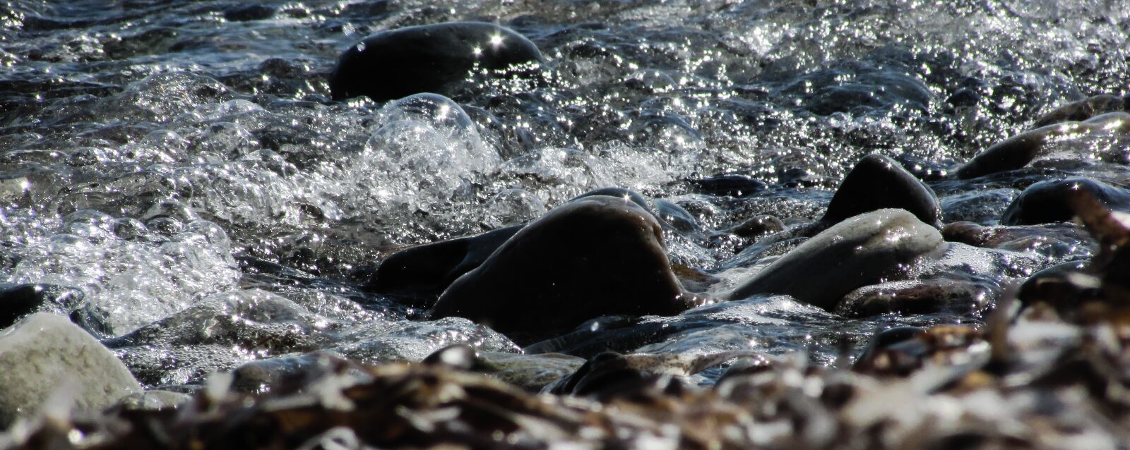 Canon PowerShot SX400 IS sample photo. Pebble beach, stones, wave photography