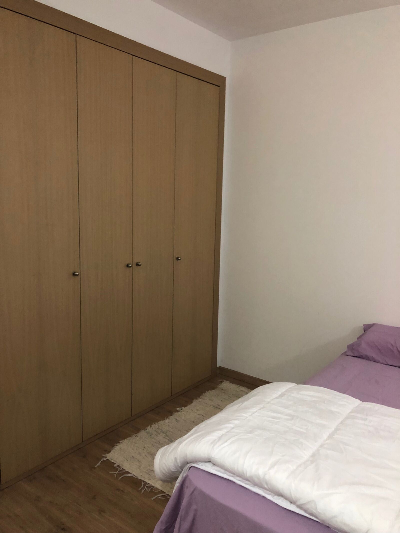 iPhone X back dual camera 4mm f/1.8 sample photo. Cupboard, bed, bedroom photography