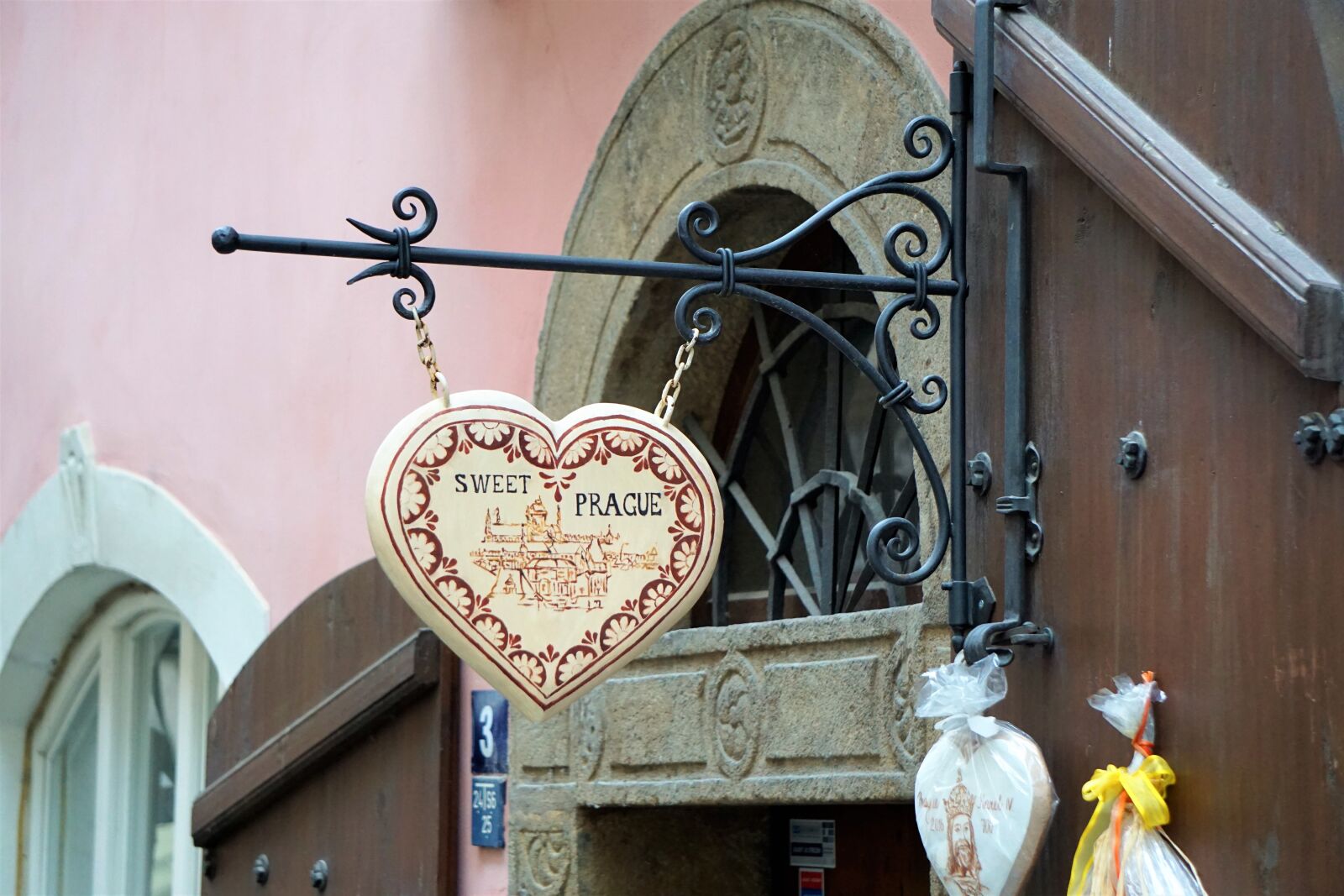 Sony E 55-210mm F4.5-6.3 OSS sample photo. Store front, prague, sweet photography