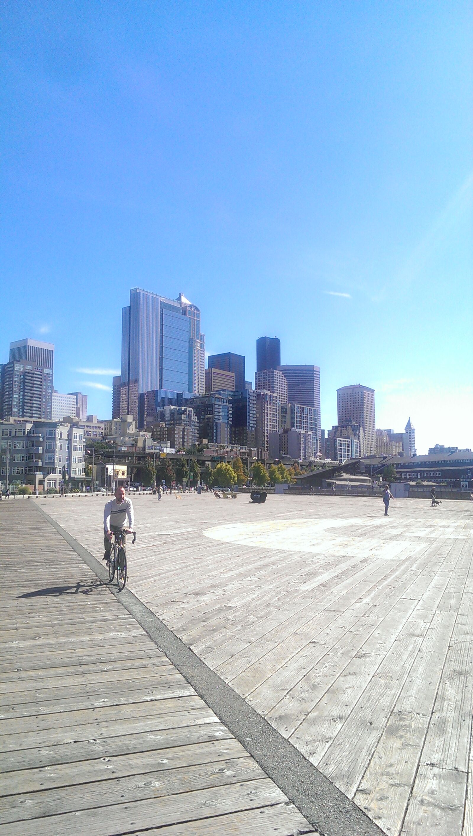 HTC ONE sample photo. Bicycle, bicyclist, pier, puget photography
