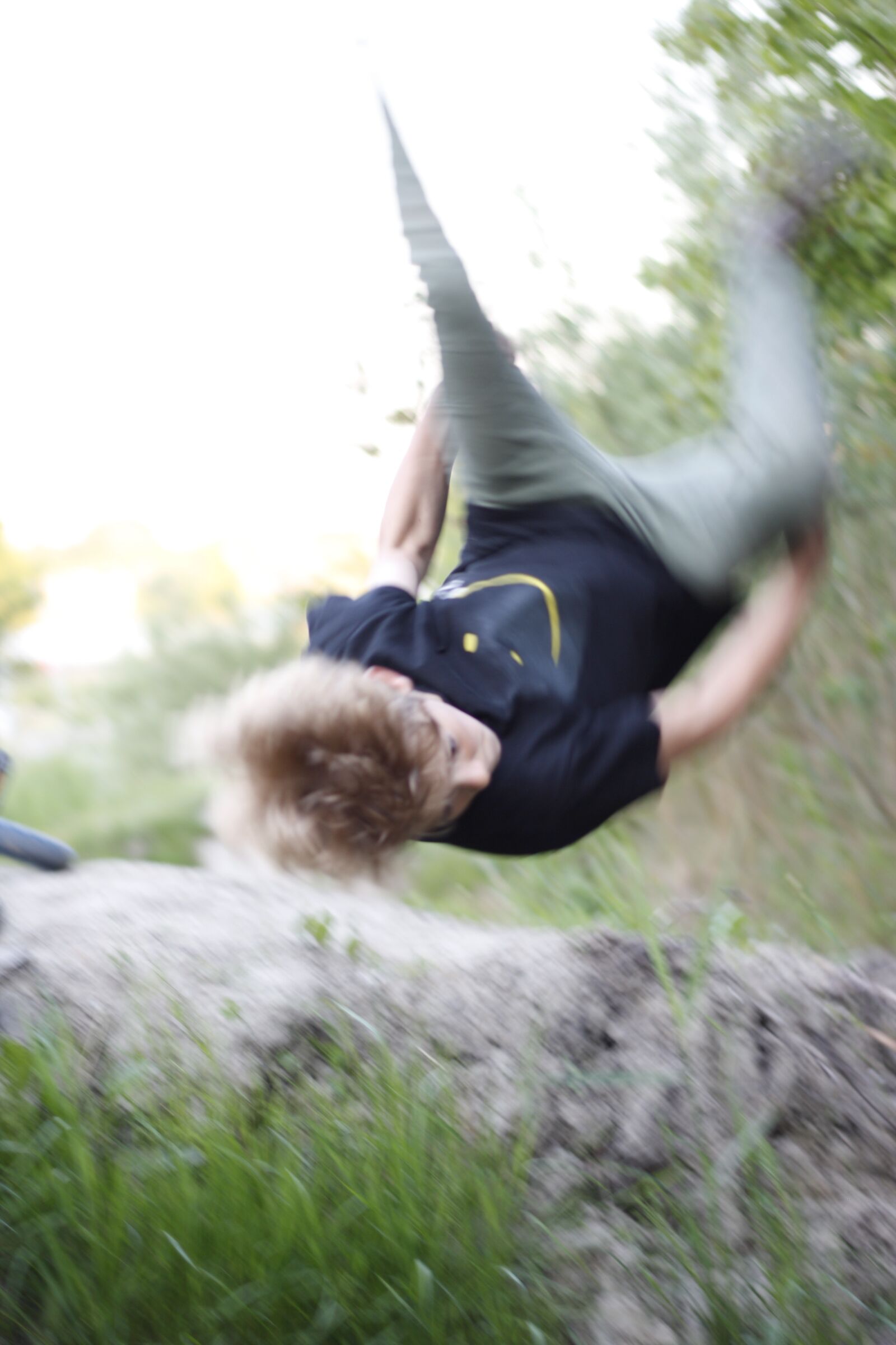 Canon EF 50mm F1.8 II sample photo. Boy, outdoor, somersault photography