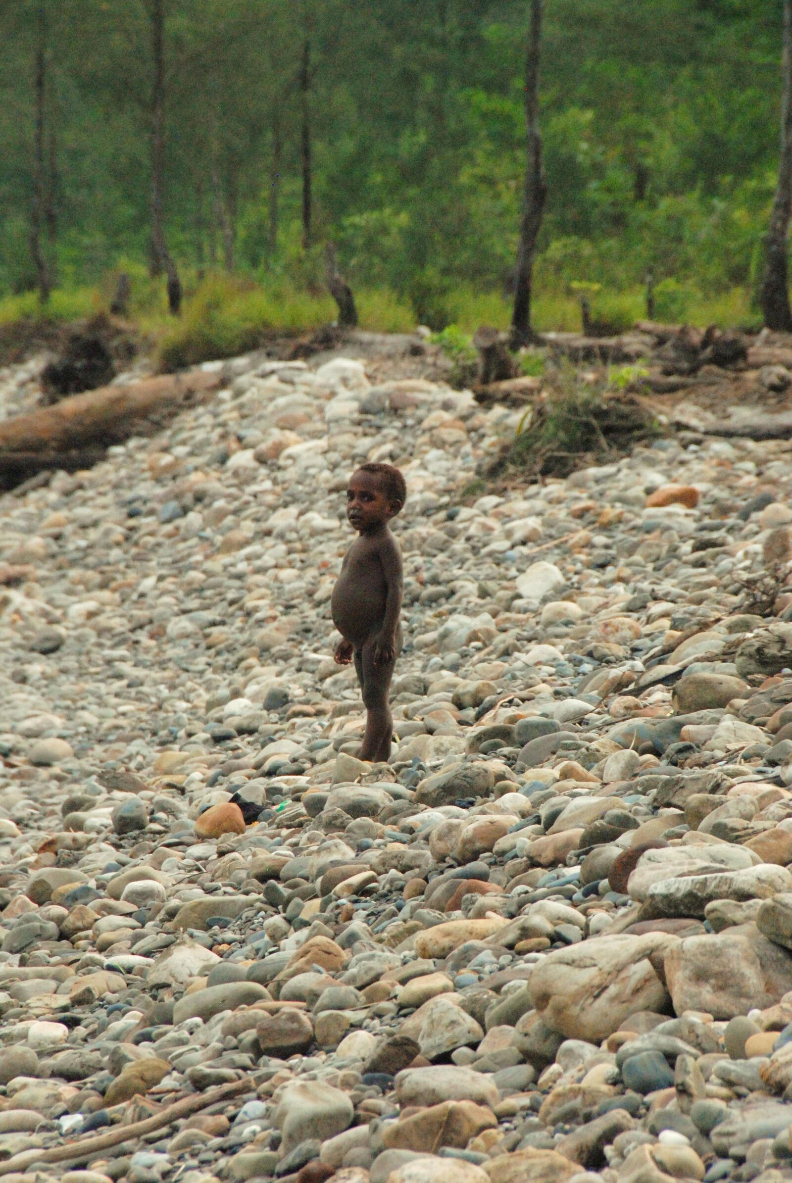 Nikon D200 sample photo. Native boy, rocks, beach photography