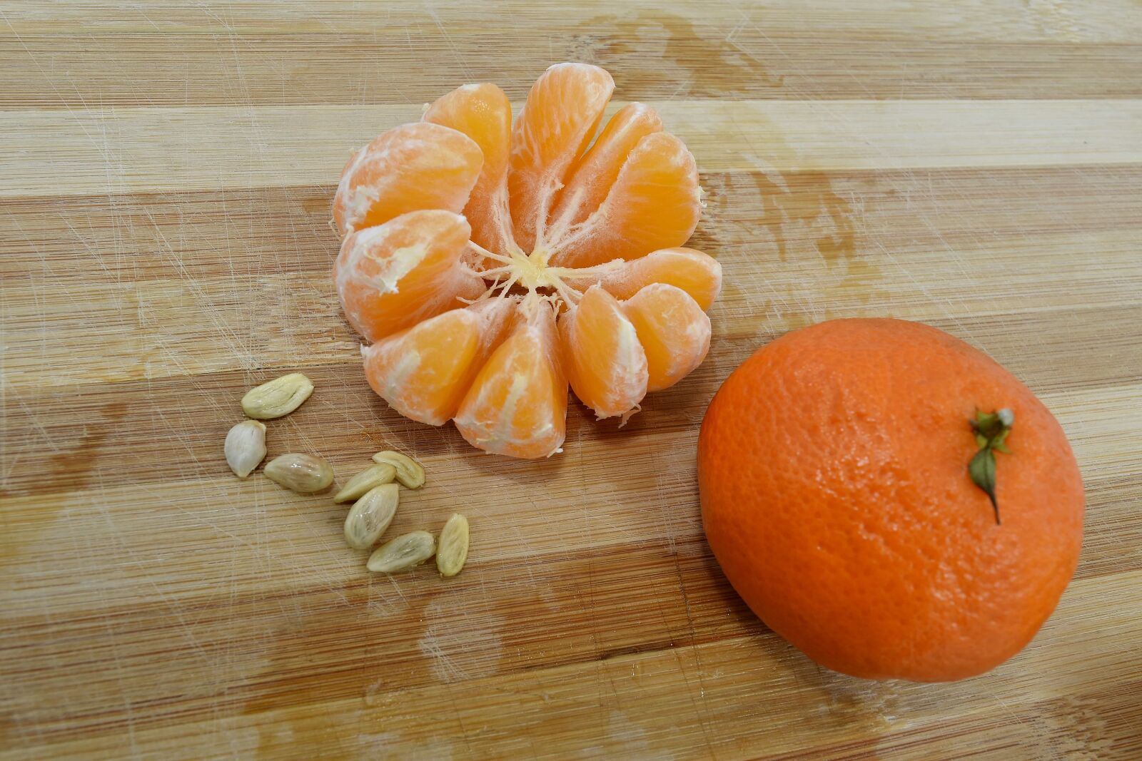 Nikon D5500 sample photo. Mandarin, oranges, seed, slices photography