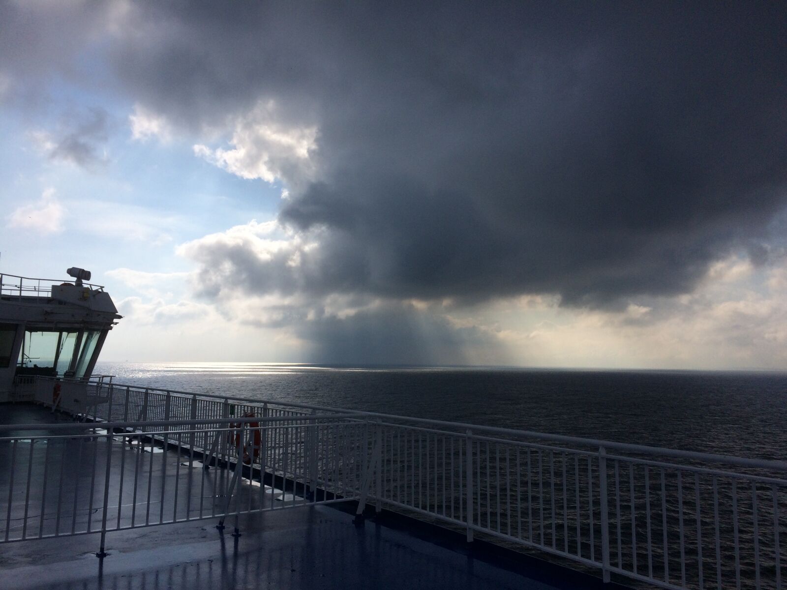 iPhone 5s back camera 4.15mm f/2.2 sample photo. Ferry, heavy clouds, rain photography