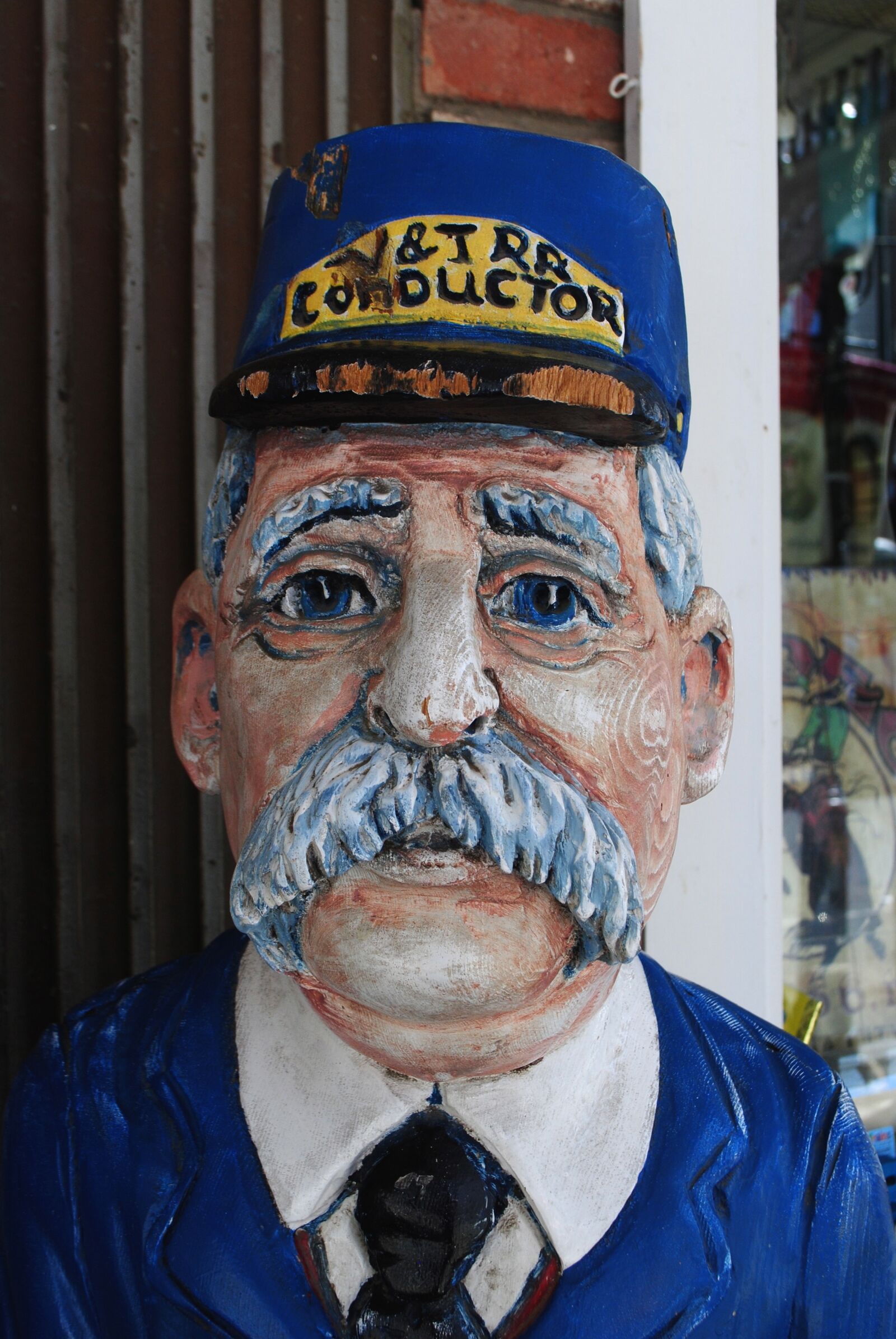 Nikon D3000 sample photo. Wood faces, train conductor photography