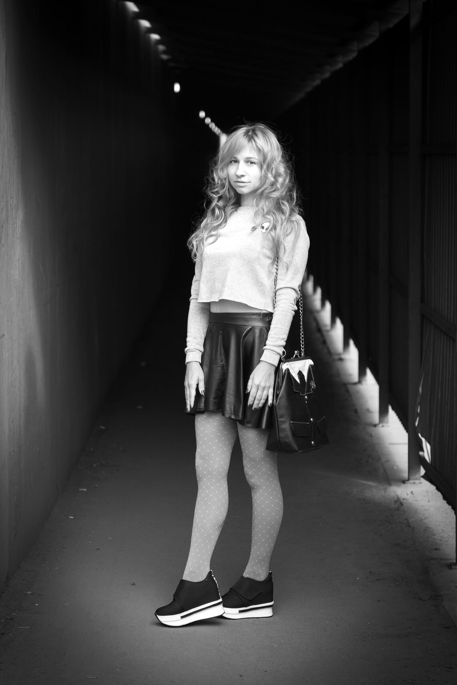 Canon EF 24-105mm F4L IS II USM sample photo. Leather skirt, sneakers, tunnel photography