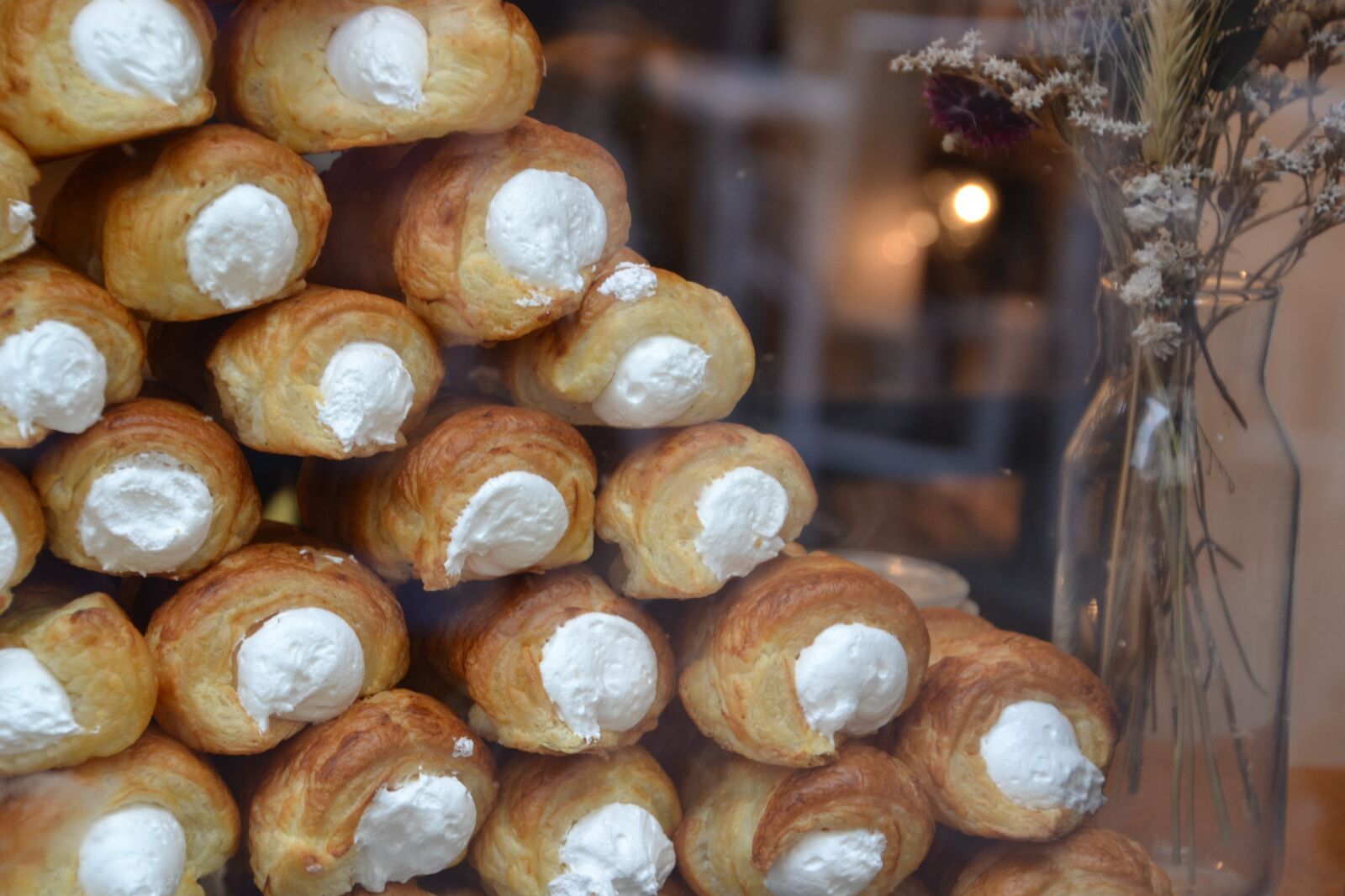 Nikon D3100 sample photo. Display, foam rollers, pastry photography