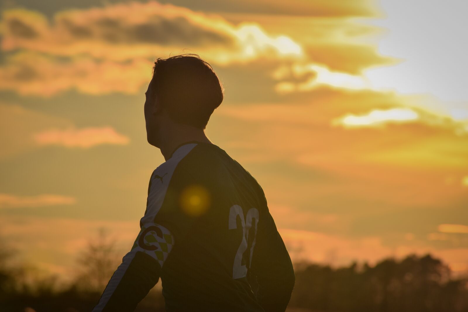 Nikon D3300 sample photo. Sunset, sunbeam, football photography