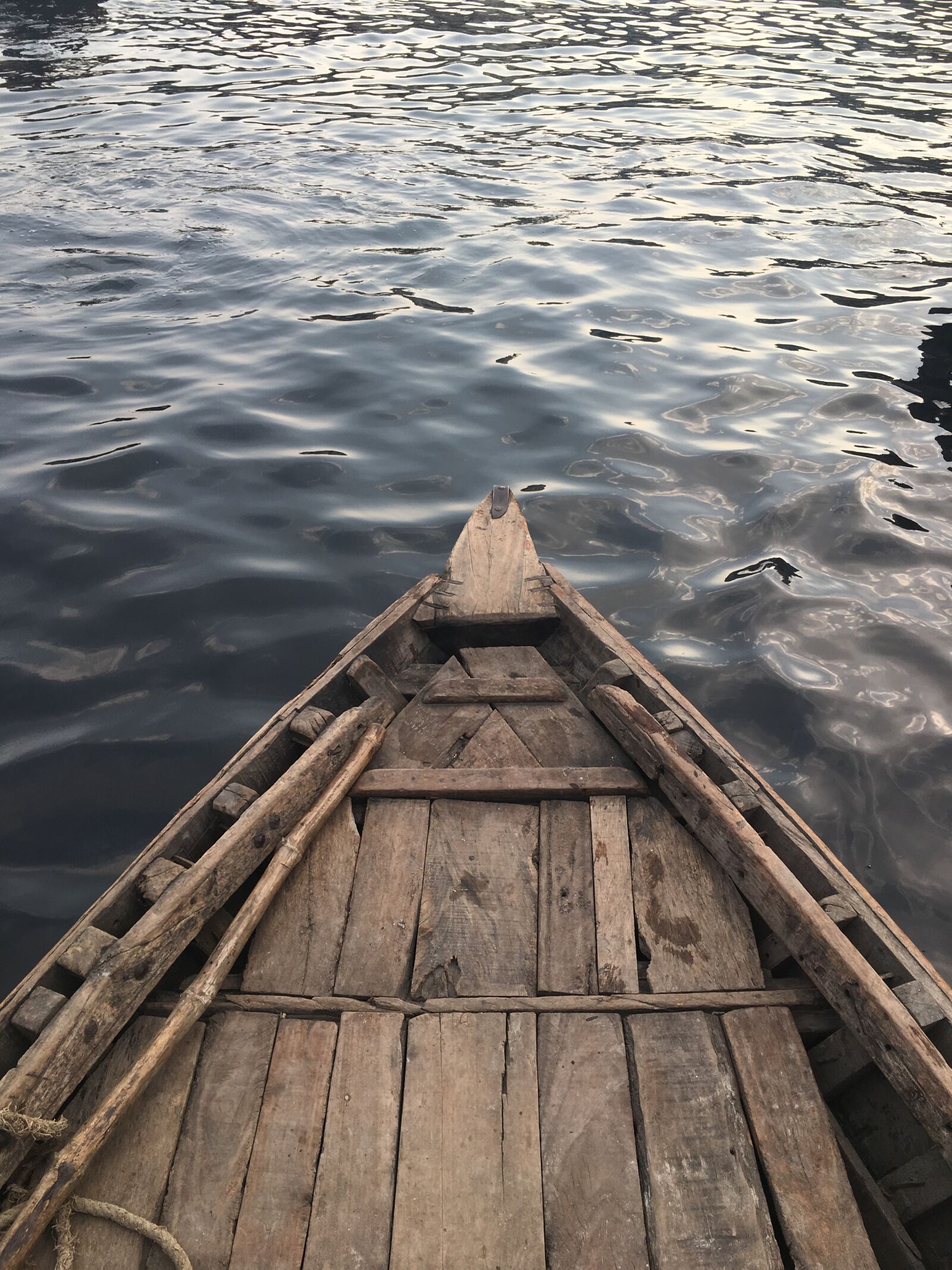 Apple iPhone 6s sample photo. Black water, boat, lone photography