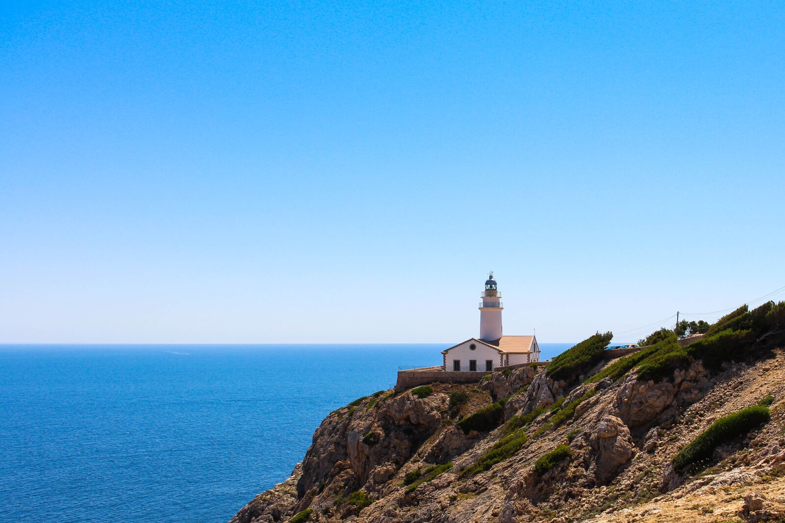Canon EF-S 18-135mm F3.5-5.6 IS sample photo. Lighthouse, spain, sea photography