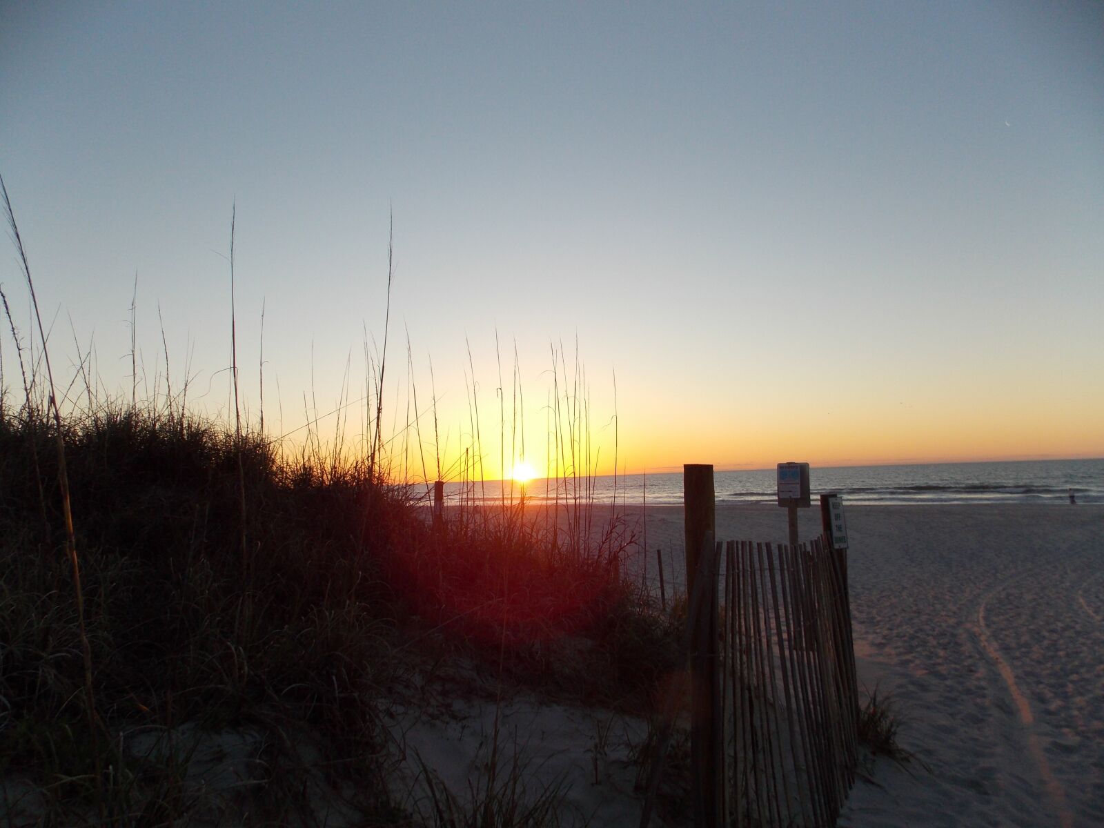 Nikon Coolpix L810 sample photo. Sunrise, beach, fence photography