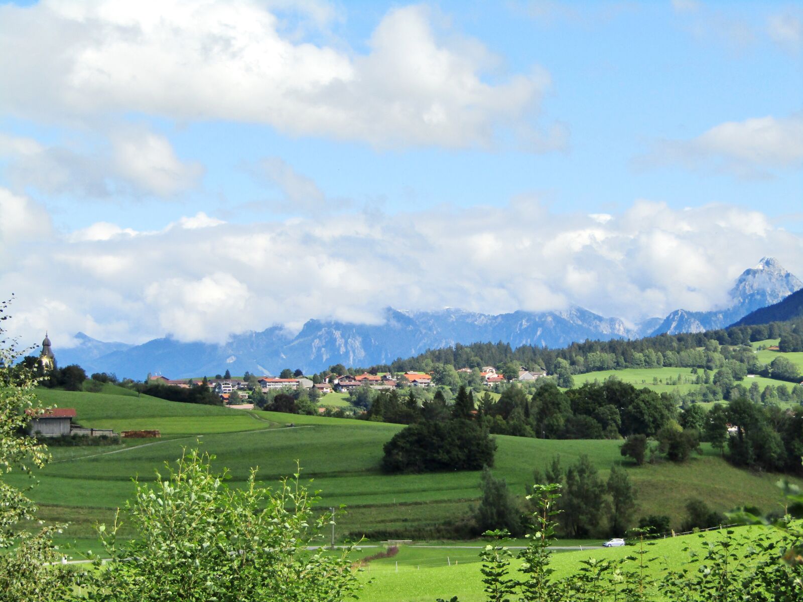 Canon POWERSHOT SX432 IS sample photo. Mountains, clouds, spire photography