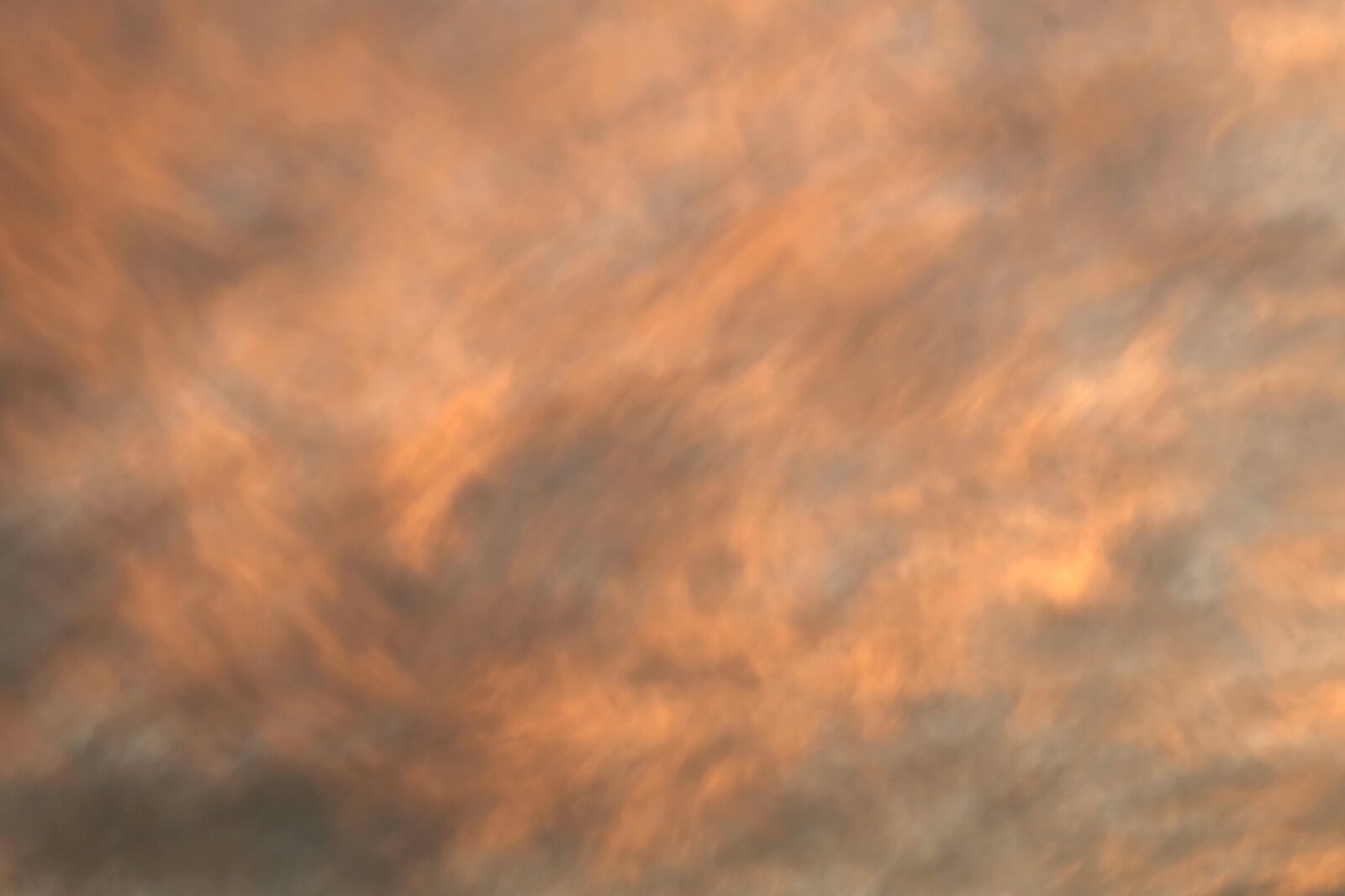 Pentax K-S2 sample photo. The background, clouds, orange photography
