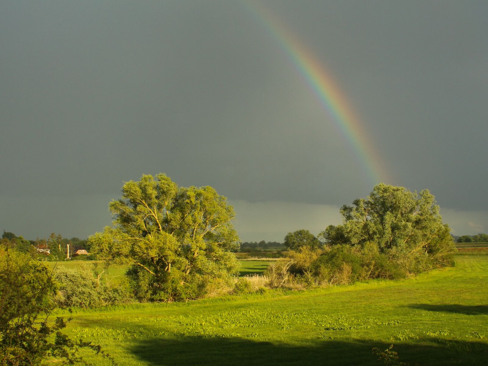 Canon EF 28-80mm f/3.5-5.6 sample photo. Rainbow, storm clouds, lighting photography