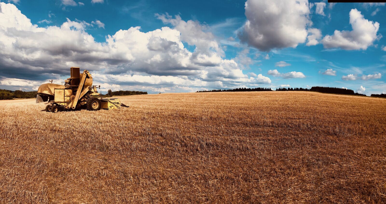 iPhone X back camera 4mm f/1.8 sample photo. Field, hayfield, tractor photography