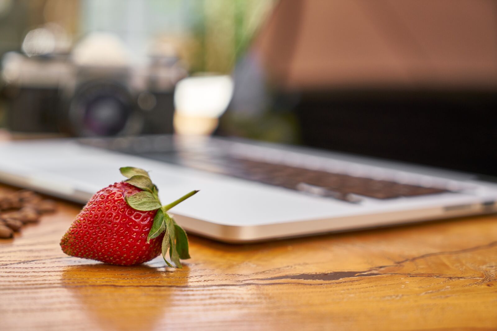 Sony a7R II sample photo. Strawberry, laptop, table photography