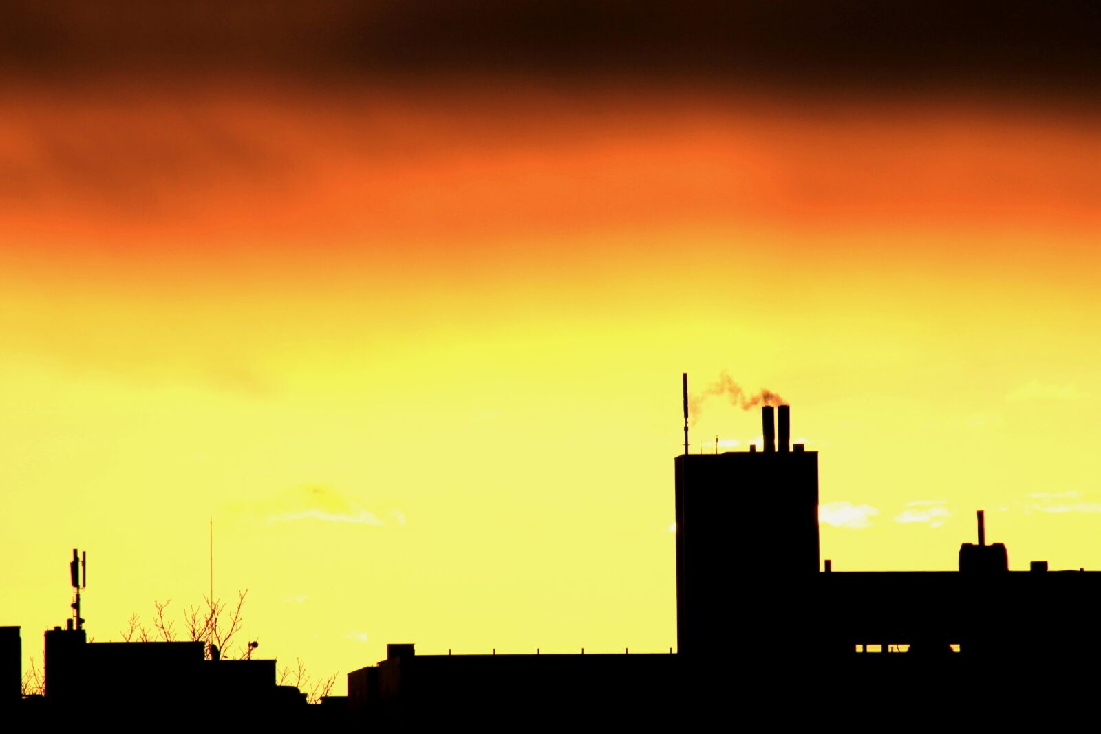 Canon EF 75-300mm f/4-5.6 sample photo. Sunrise, silhouette, city photography