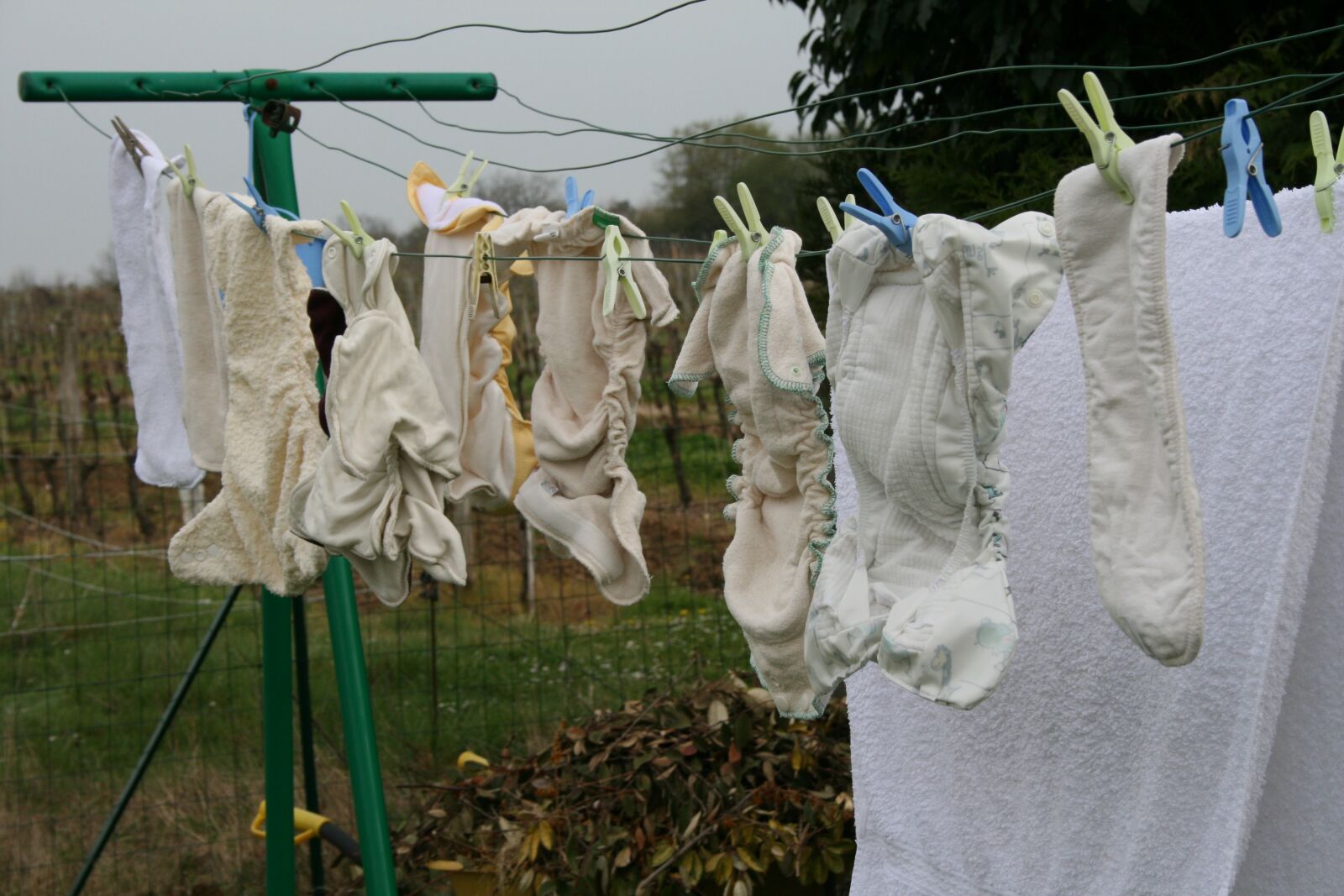 Canon EOS 400D (EOS Digital Rebel XTi / EOS Kiss Digital X) sample photo. Layers, babies, clothes rack photography