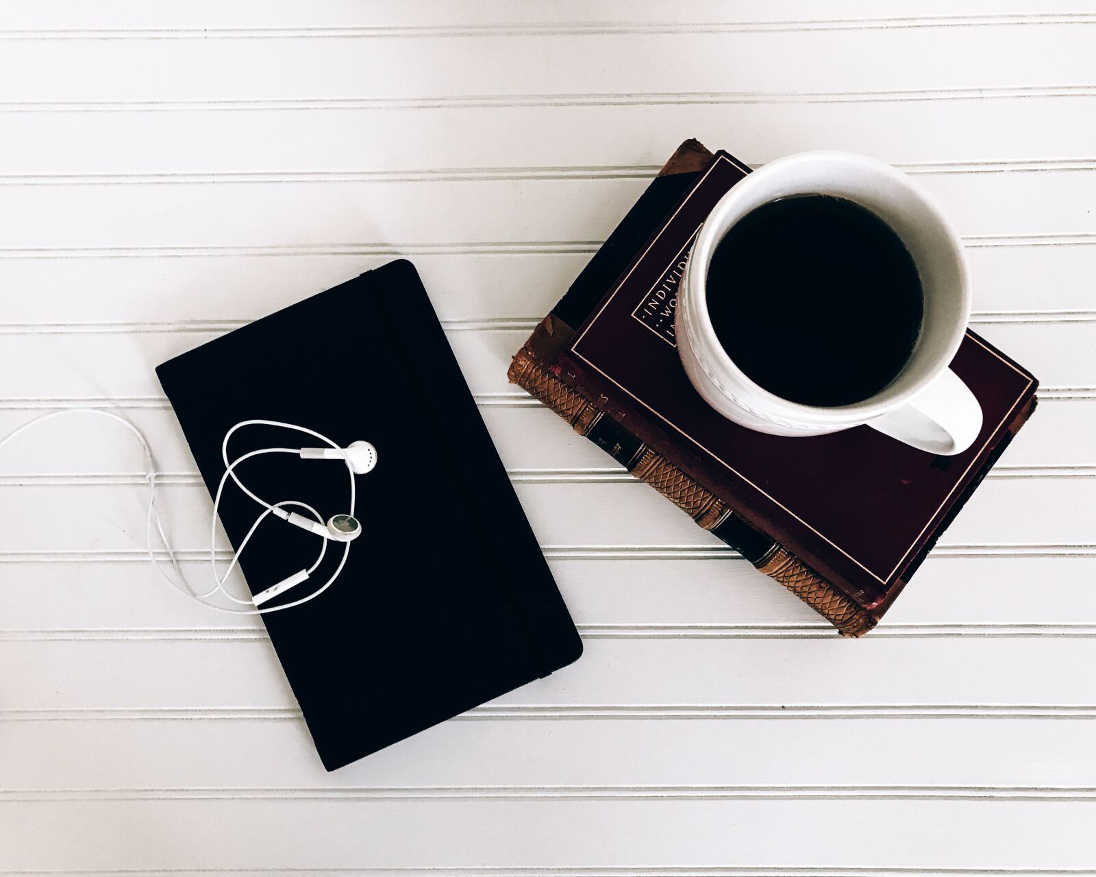 Apple iPhone 7 sample photo. Books, ear buds, from photography