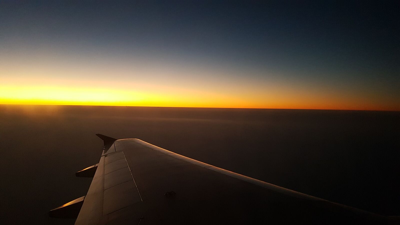 Samsung Galaxy S7 Edge sample photo. Wing, plane, sunset photography