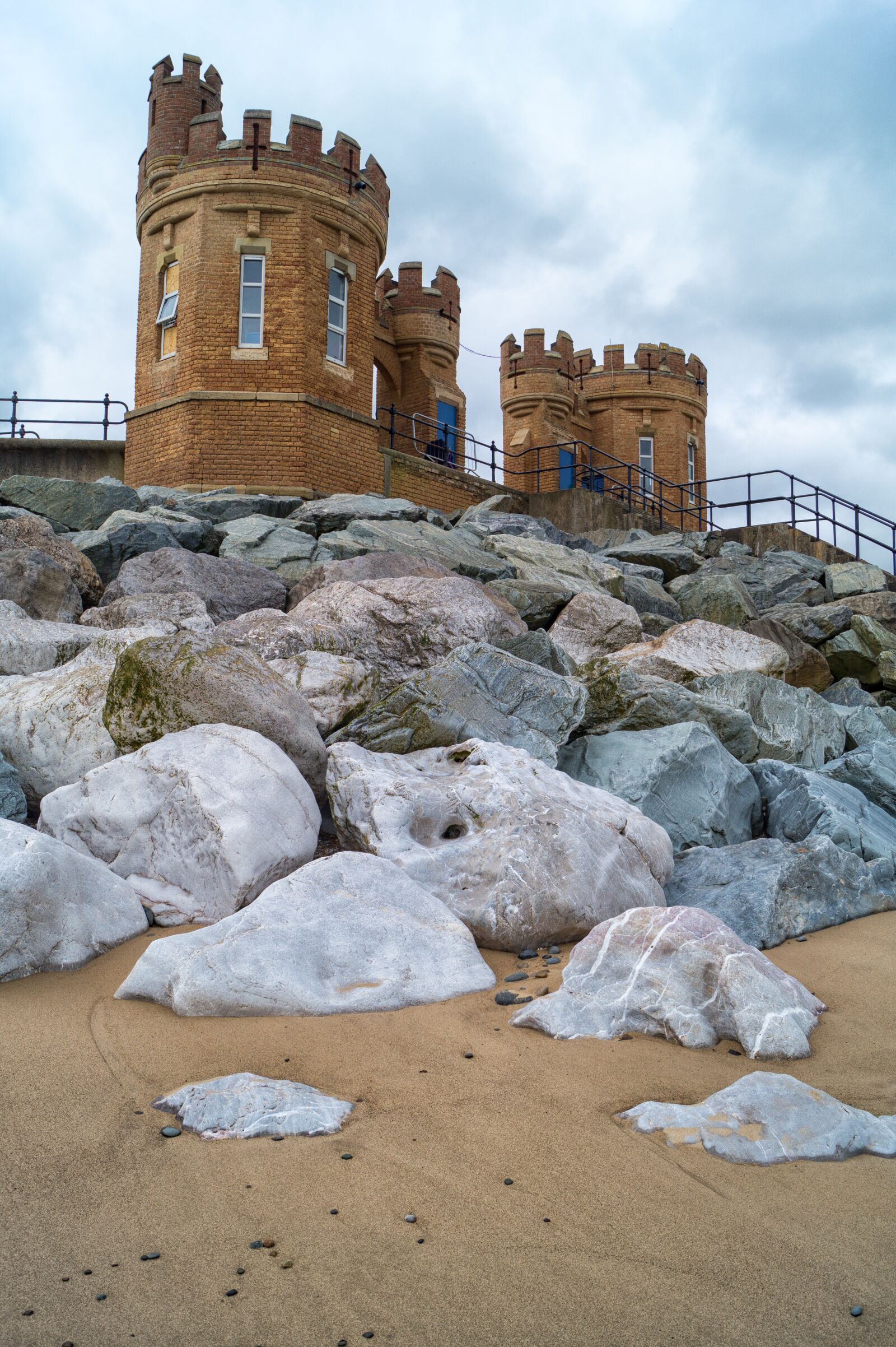 Sony SLT-A58 sample photo. Withernsea, rocks, sand photography