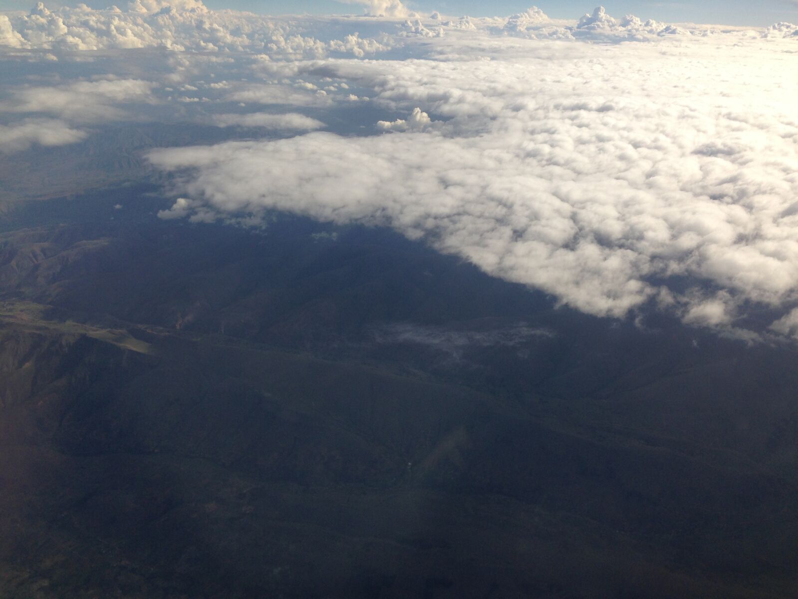 iPhone 5 back camera 4.12mm f/2.4 sample photo. Sky, clouds, plane photography