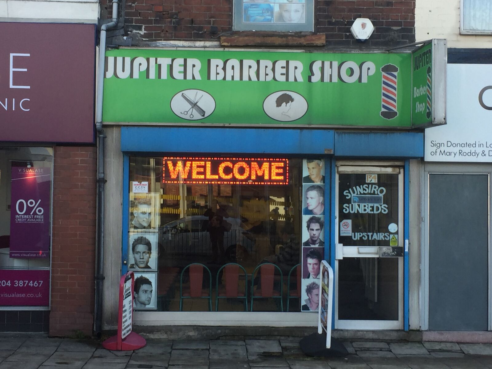 iPhone 6 back camera 4.15mm f/2.2 sample photo. Barber shop, street, barber photography
