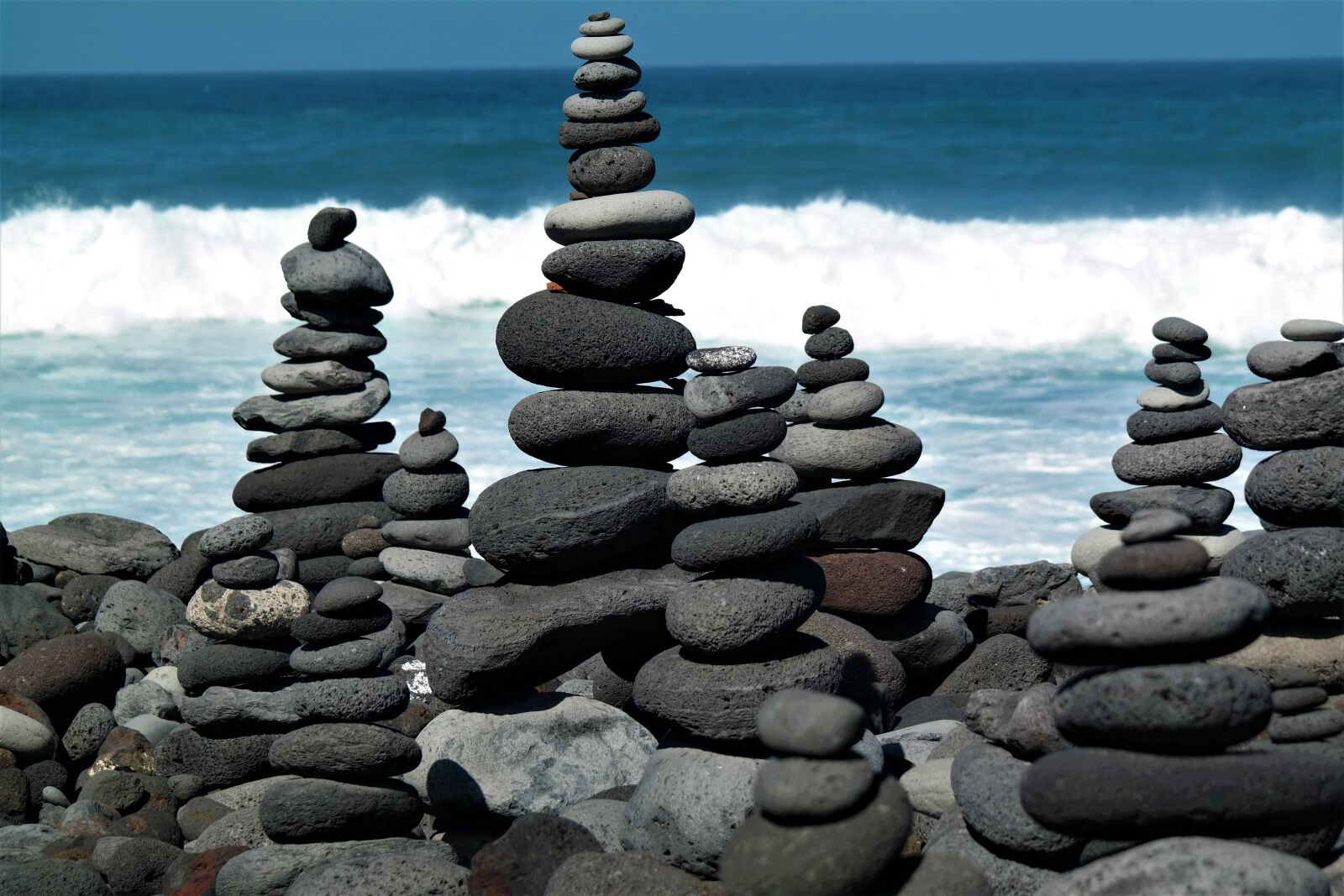 Samsung NX30 sample photo. Stone tower, beach, water photography