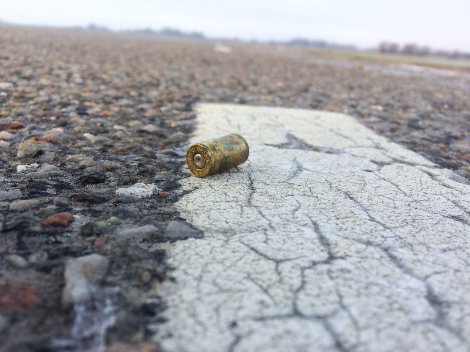 iPhone 5s back camera 4.15mm f/2.2 sample photo. Casing, gun, bullet photography