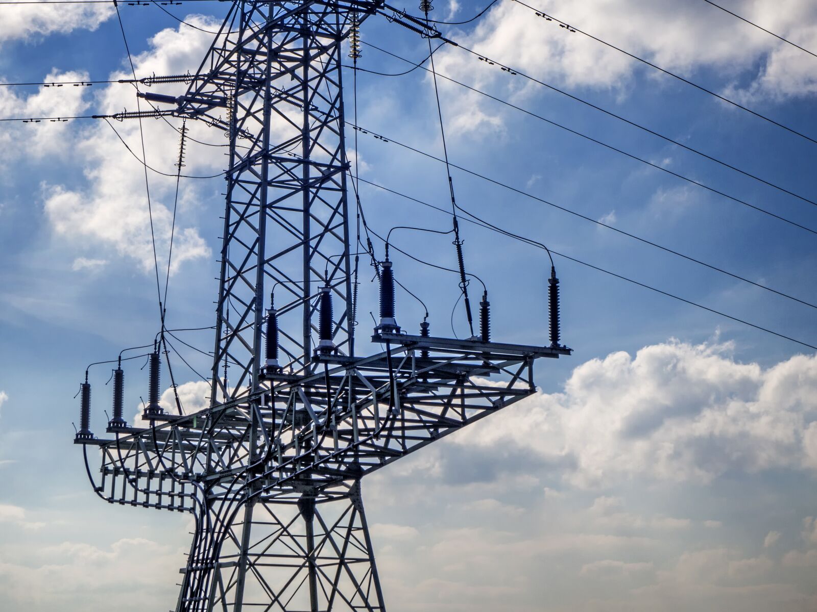 Olympus OM-D E-M10 sample photo. Strommast, current, wires photography