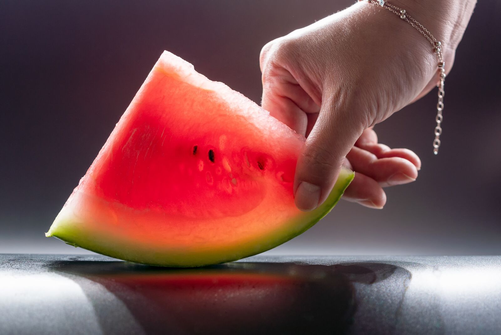 Sony a7R III + Sony FE 90mm F2.8 Macro G OSS sample photo. Watermelon, hand, take photography