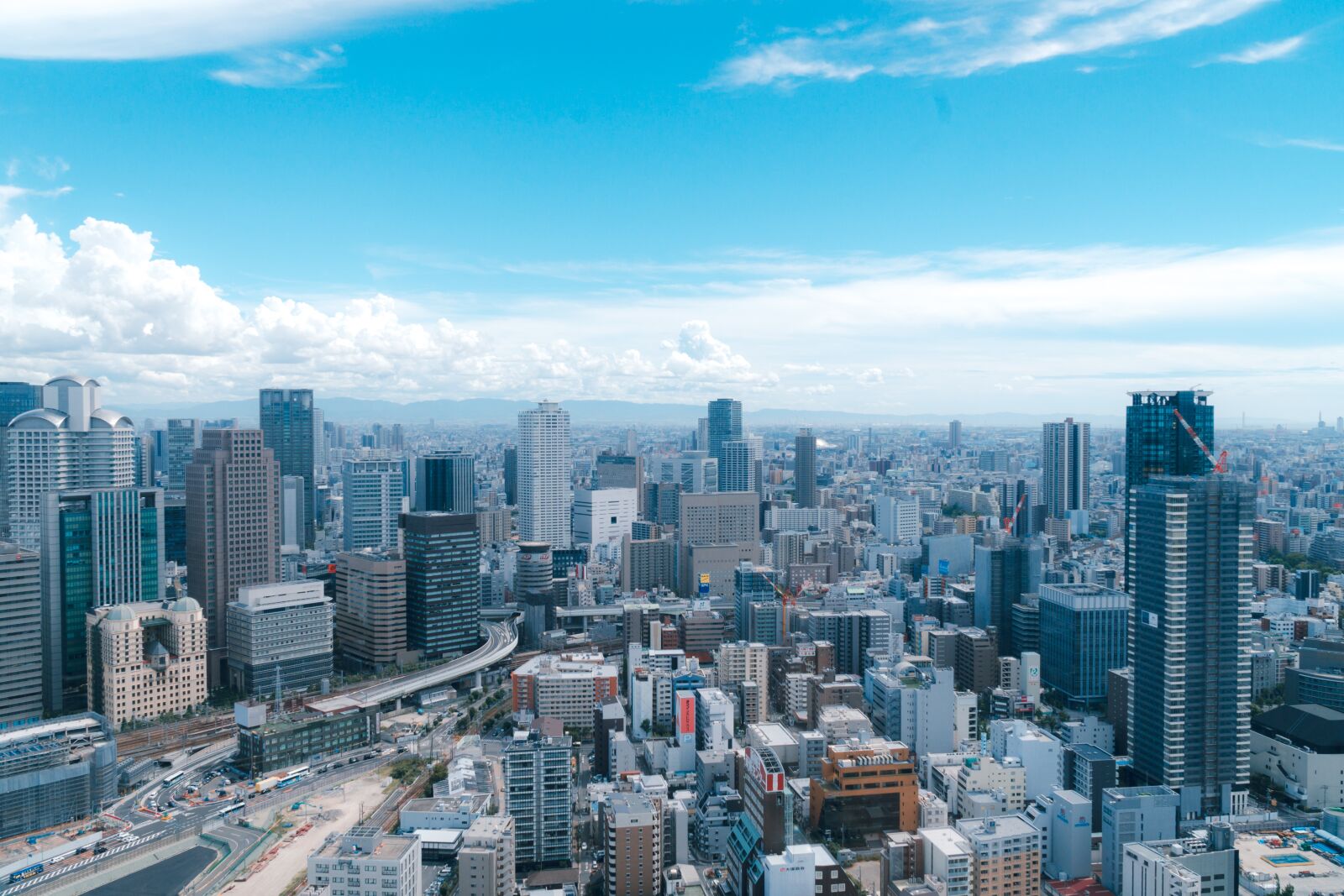 Sony a7R II + Sony E PZ 18-105mm F4 G OSS sample photo. City, sky, tall buildings photography