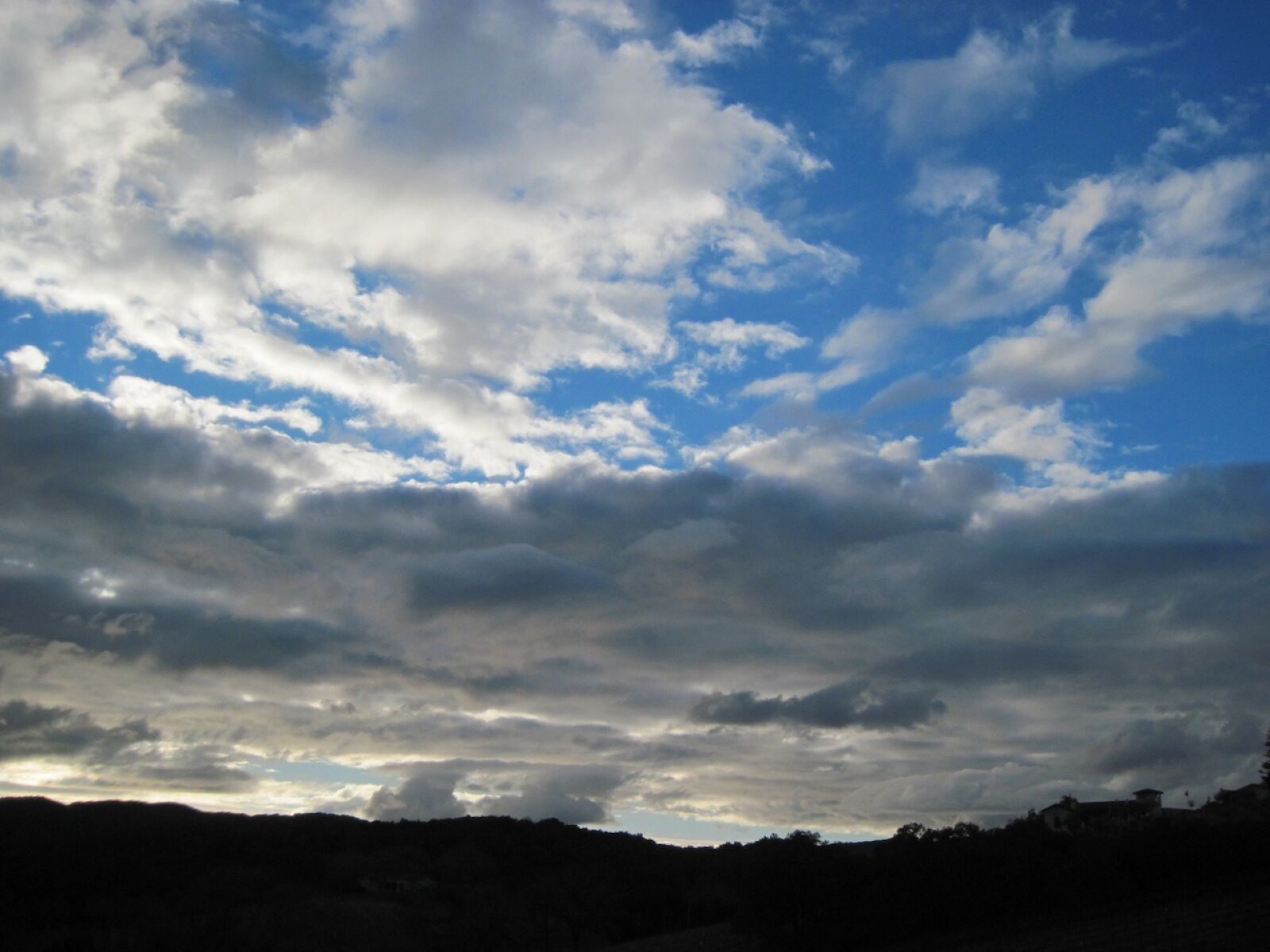 Canon PowerShot A1100 IS sample photo. Silhouette, back light, clouds photography