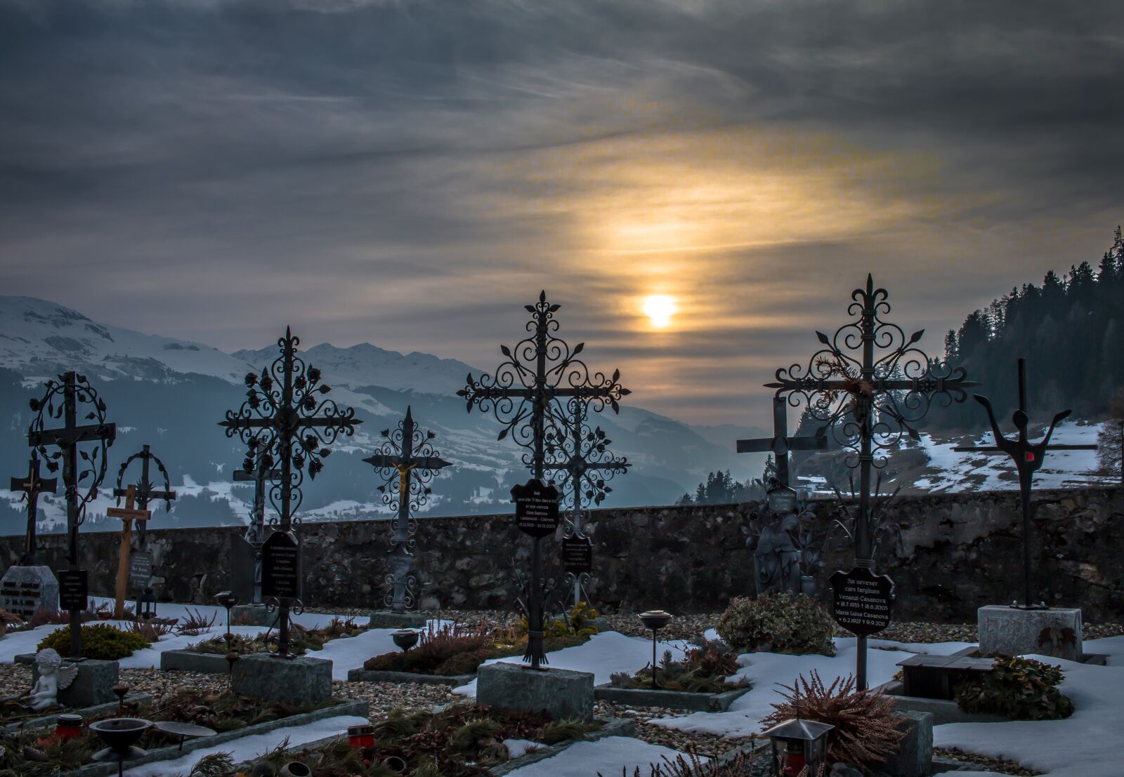 Canon EF-S 24mm F2.8 STM sample photo. Cemetery, sunset, snow photography