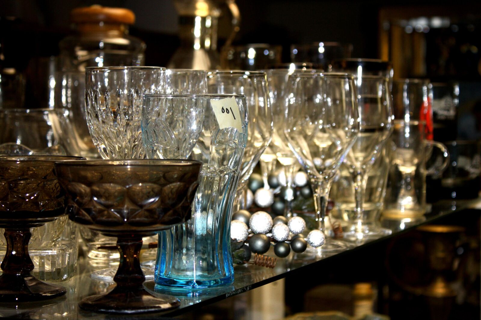 f/3.5-5.6 IS sample photo. Glassware, display, thrift shop photography