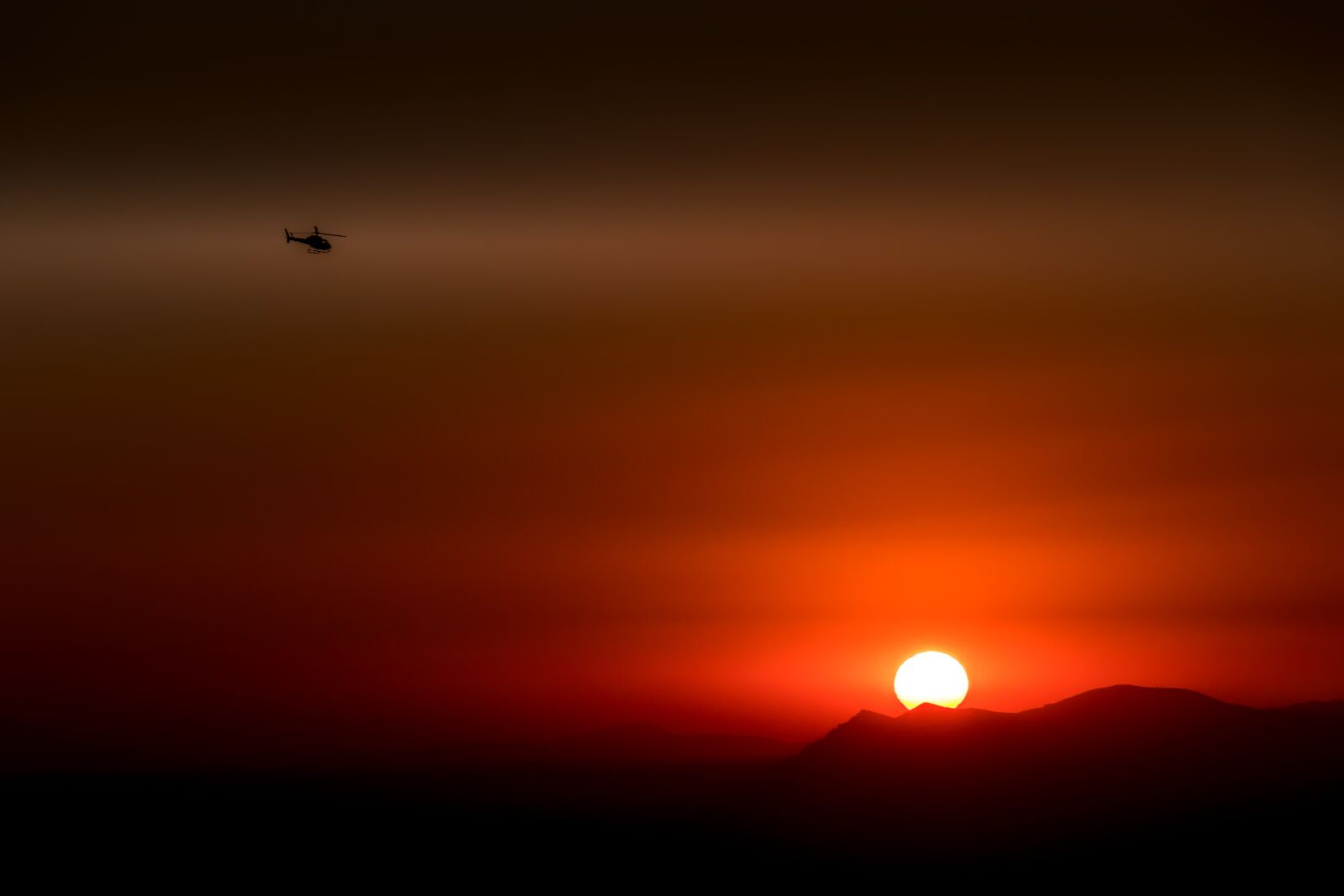 Canon EF-S 18-135mm F3.5-5.6 IS USM sample photo. Santorini, greece, helicopter photography