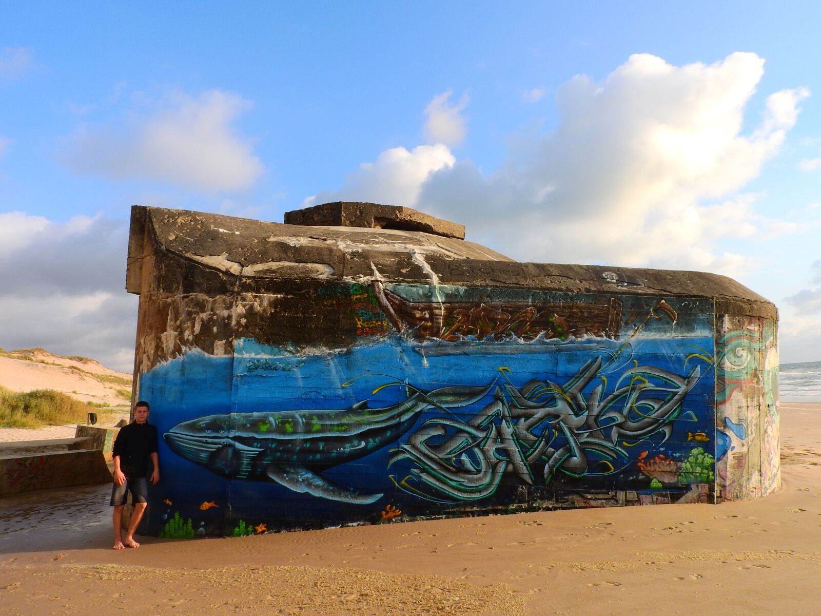 Nikon Coolpix P610 sample photo. Bunker, beach, grafitti photography