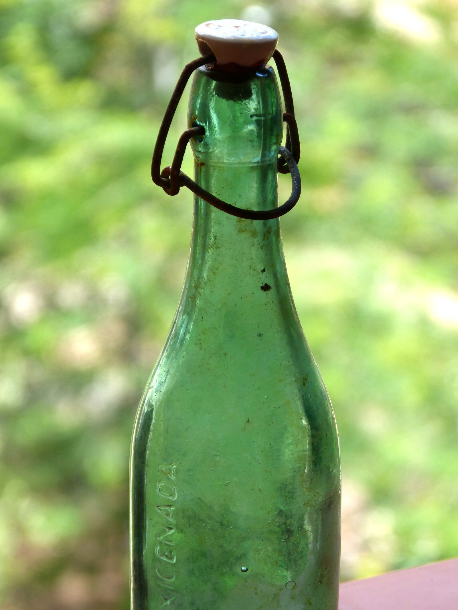 Panasonic DMC-FZ62 sample photo. Bottle, green glass, old photography