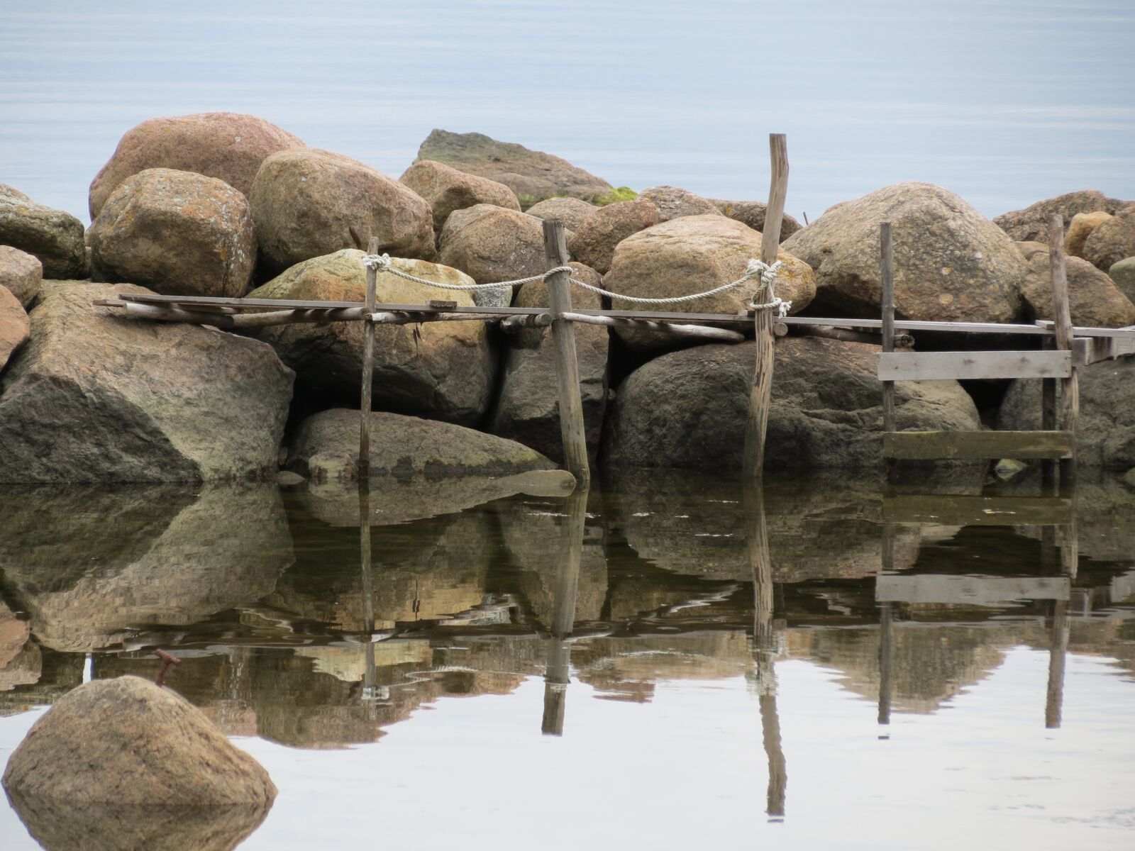 Canon PowerShot SX40 HS sample photo. The stones, sea, bridge photography