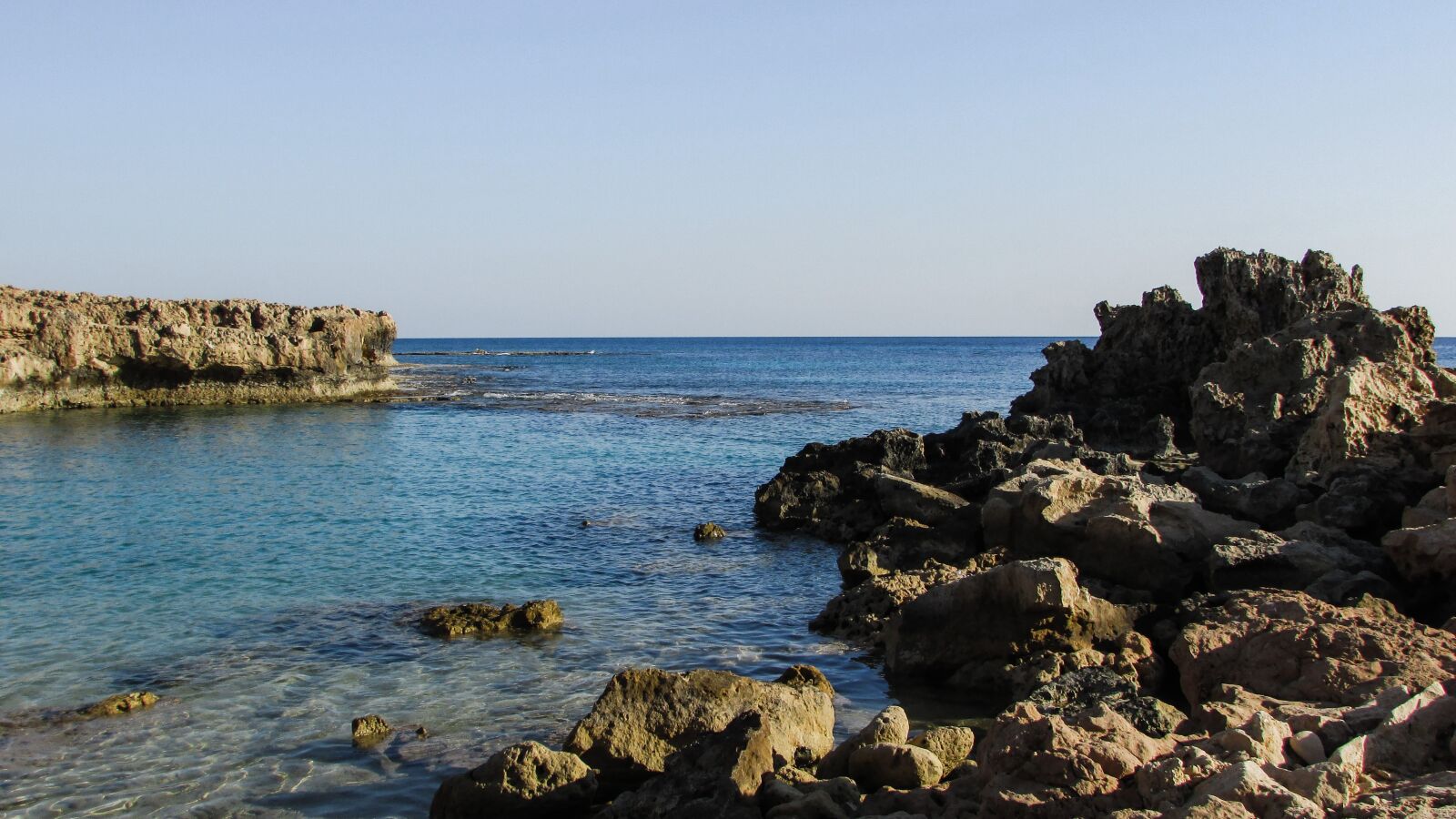 Canon PowerShot SX400 IS sample photo. Rocky coast, lagoon, blue photography
